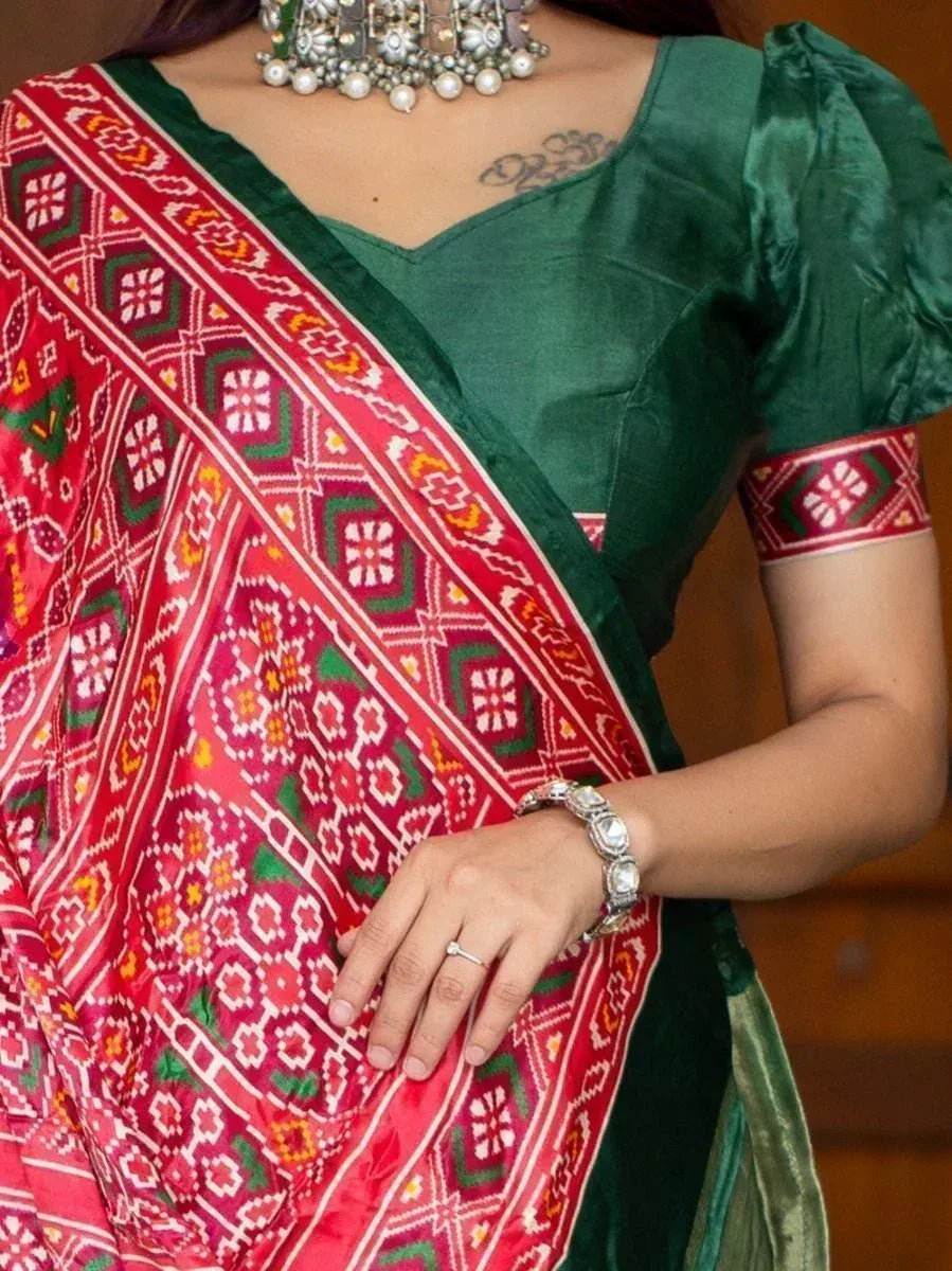 Green satin blouse with red printed saree, ethnic Indian wear, traditional jewelry