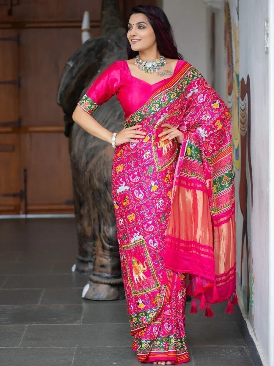 Vibrant pink ethnic saree with elephant motifs, perfect for Indian occasions and festive wear.
