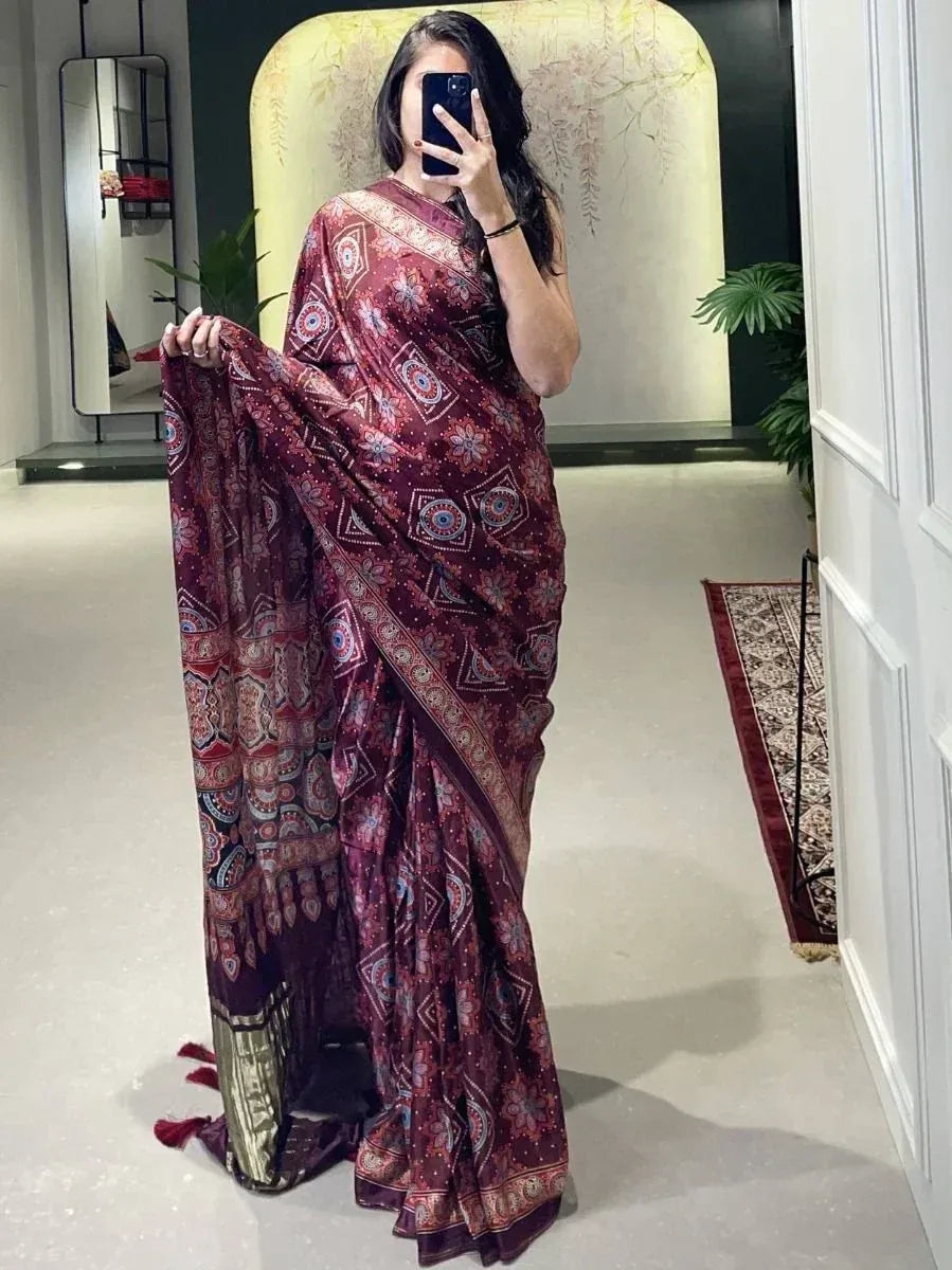 Maroon printed saree with intricate floral and geometric patterns, perfect for ethnic occasions