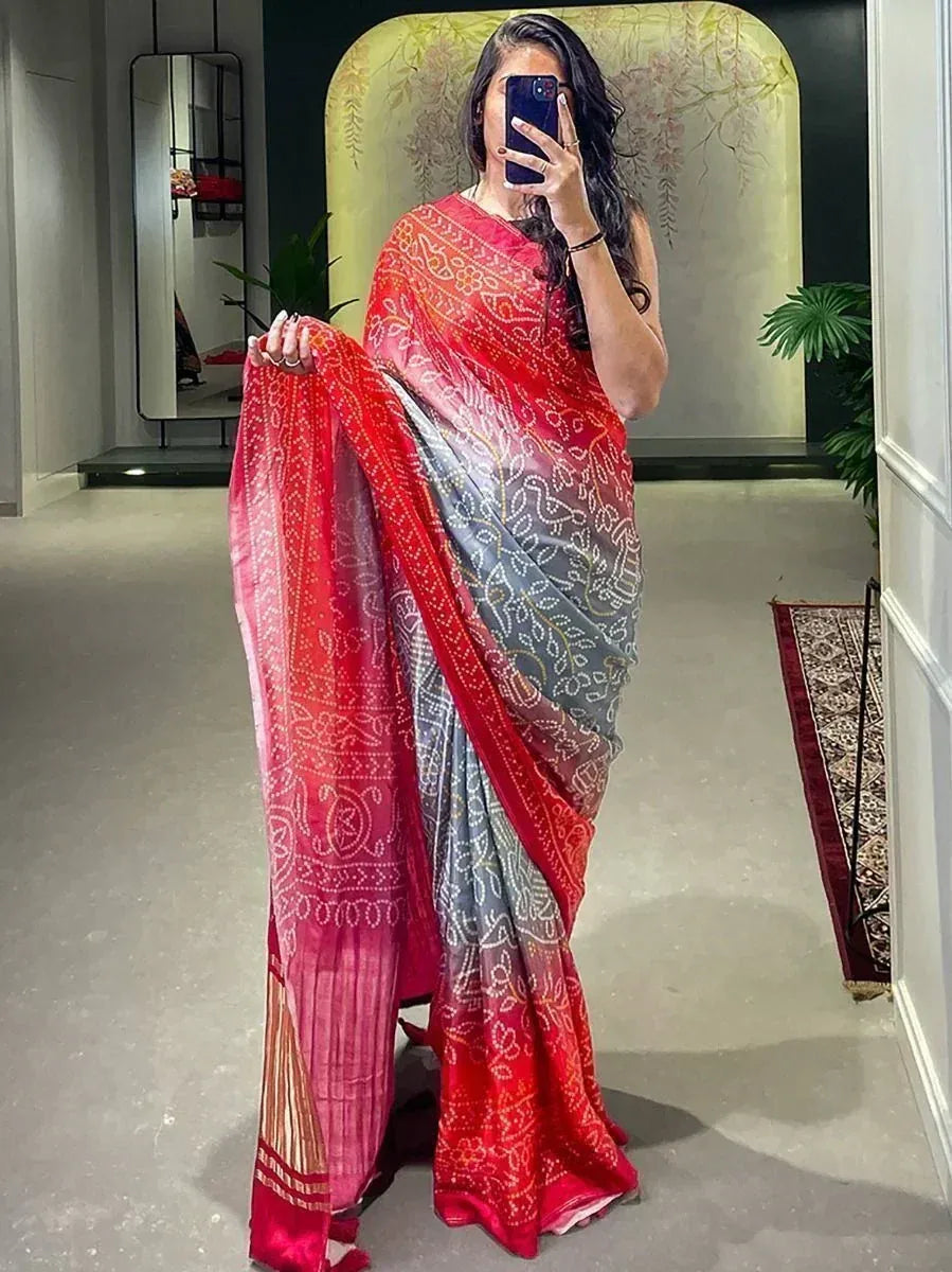 Woman in red and grey printed saree with ethnic bandhani design, perfect for Indian occasions