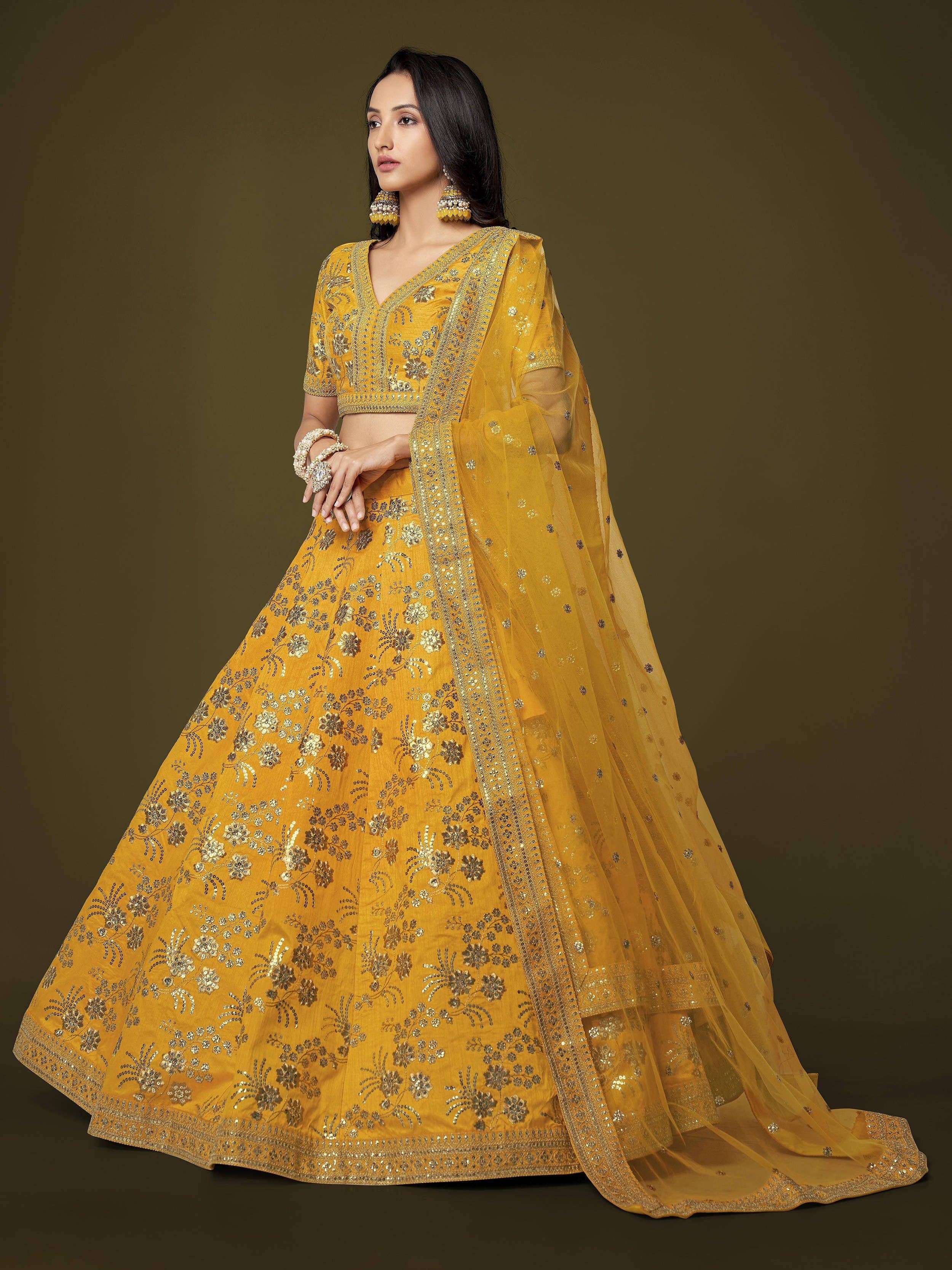Yellow designer lehenga choli with floral embroidery and sequins, perfect for Indian ethnic wear occasions