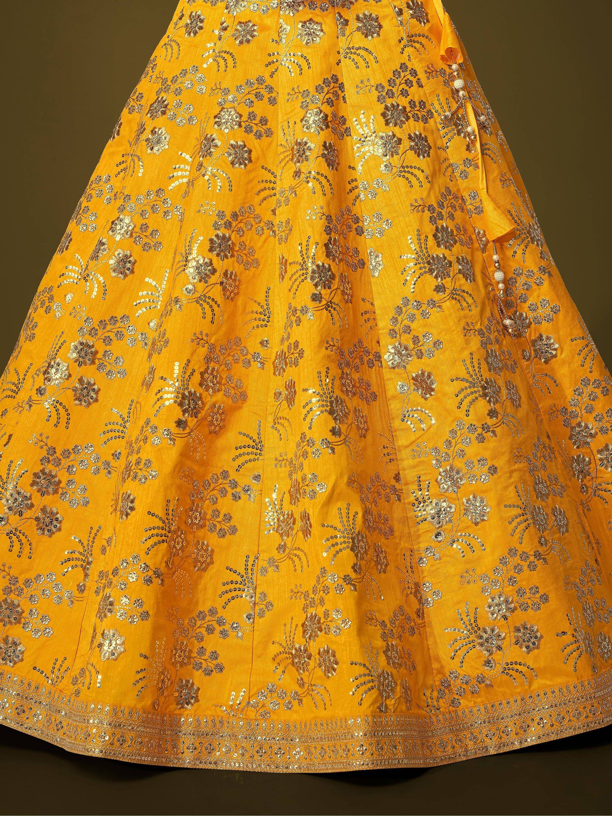 Yellow lehenga with intricate floral embroidery and sequin detailing, perfect for Indian ethnic wear.