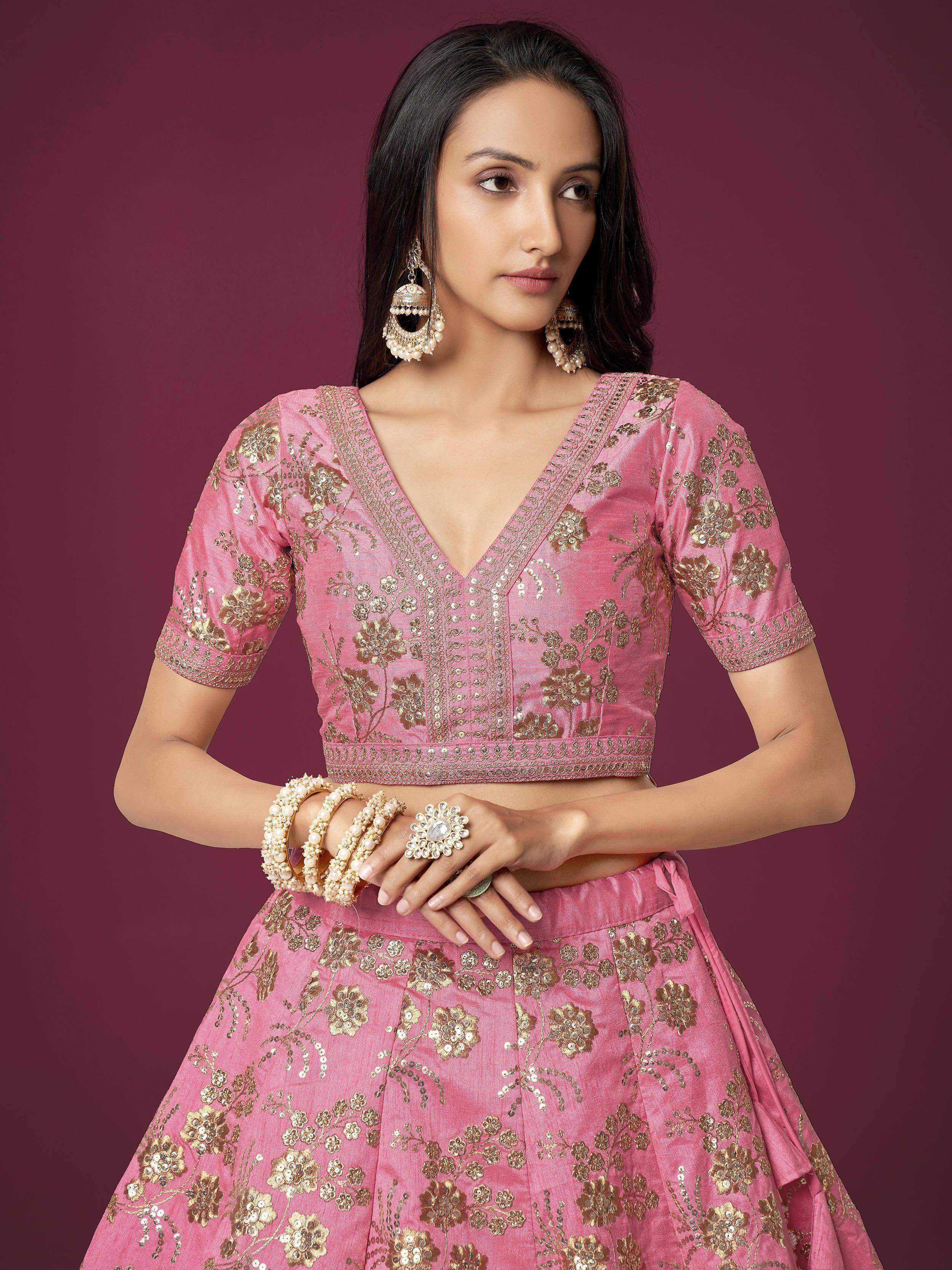 Pink floral embroidered lehenga choli with gold detailing, perfect for Indian ethnic wear occasions