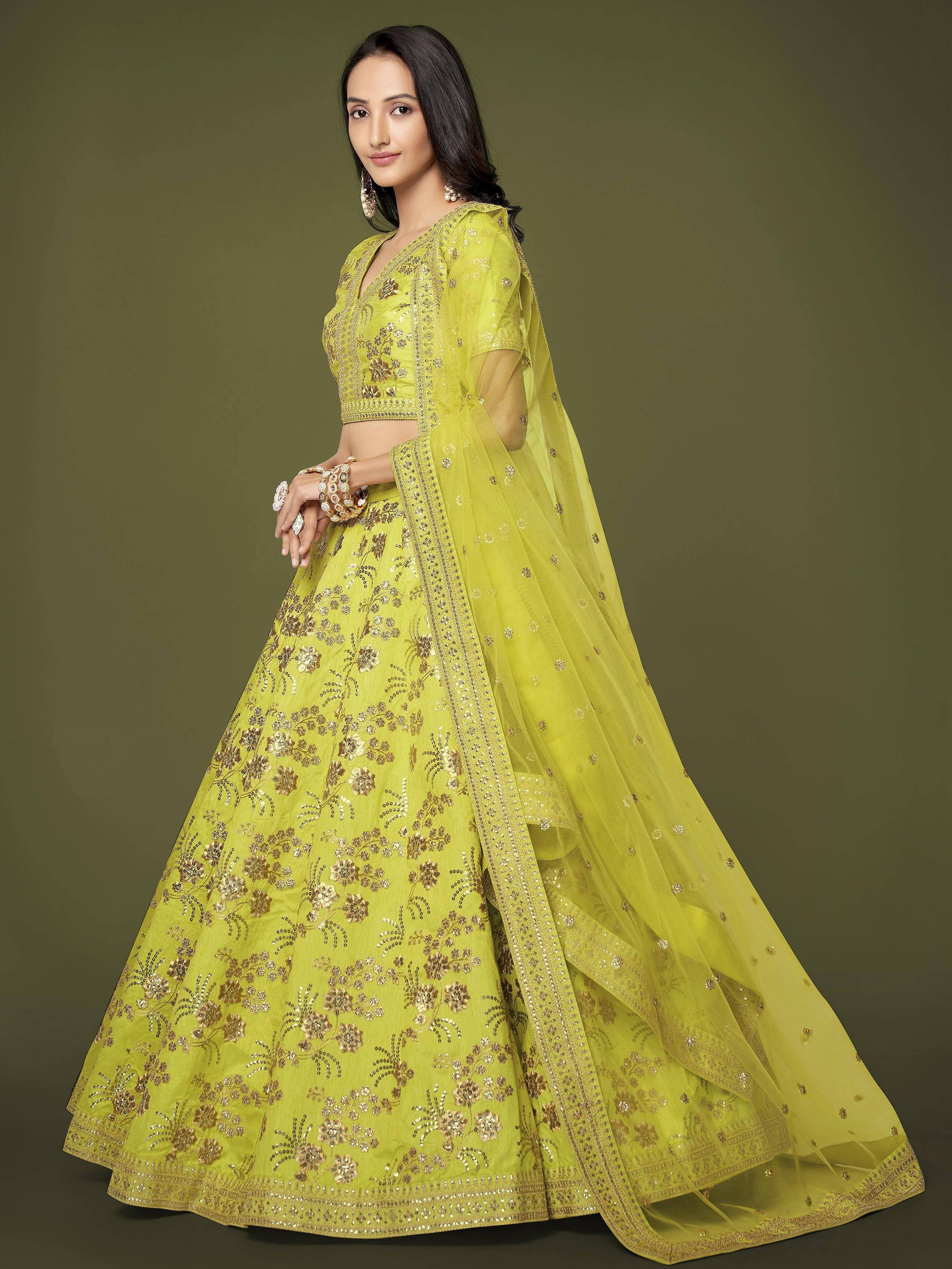 Lime green designer lehenga choli with gold floral embroidery and sheer dupatta for Indian ethnic wear
