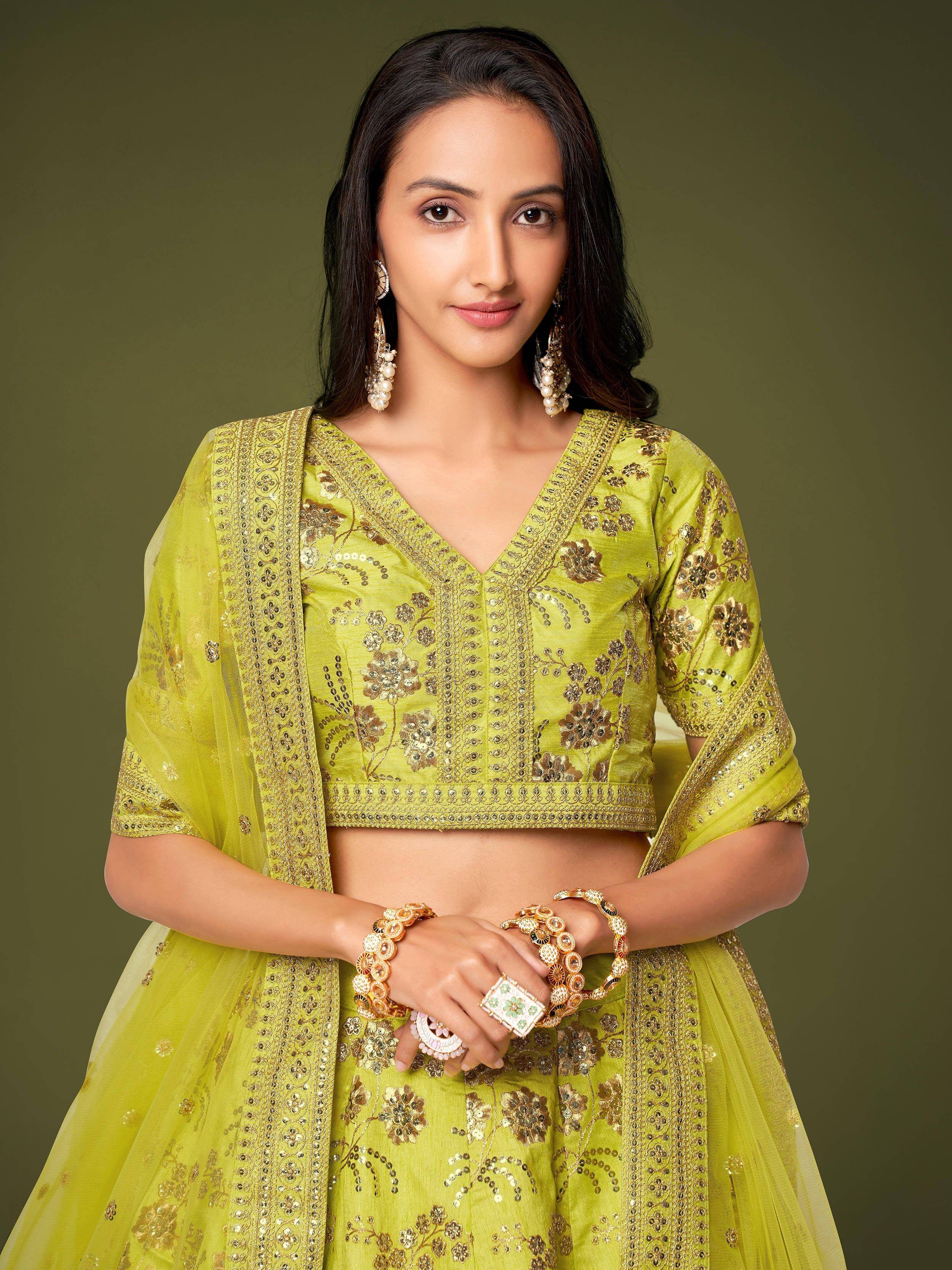 Lime green embroidered lehenga choli with gold floral work, perfect for Indian ethnic wear occasions