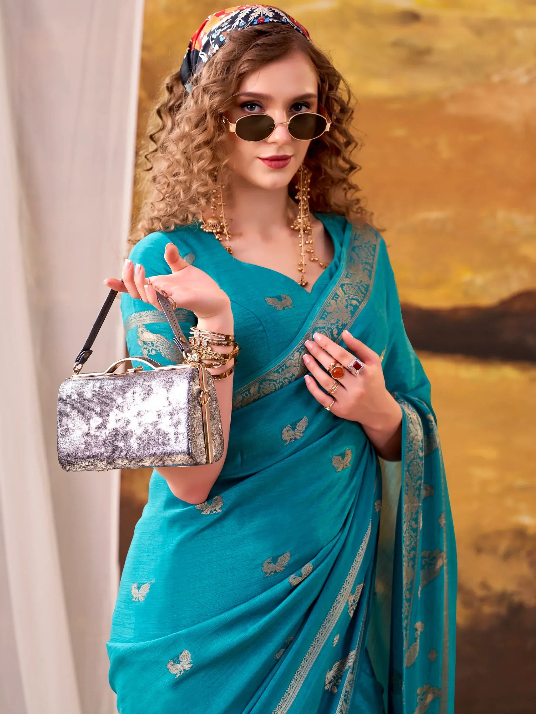 Ravishing Teal Blue Zari Weaving Crepe Casual Wear Saree With Blouse