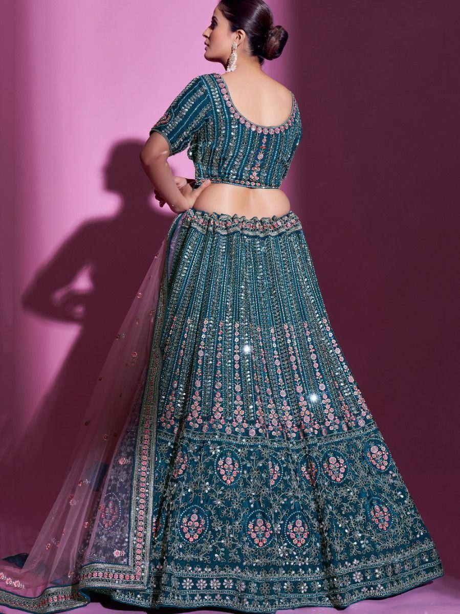 Teal designer lehenga choli with floral embroidery and mirror work, perfect for Indian ethnic wear