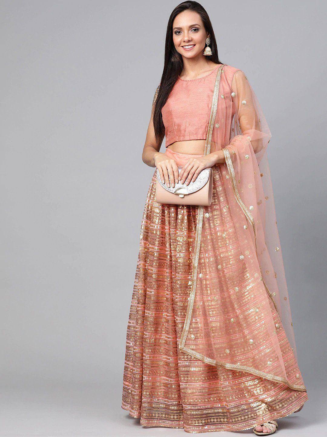 Pink designer lehenga choli with gold embroidery and sheer dupatta, perfect for Indian ethnic wear occasions
