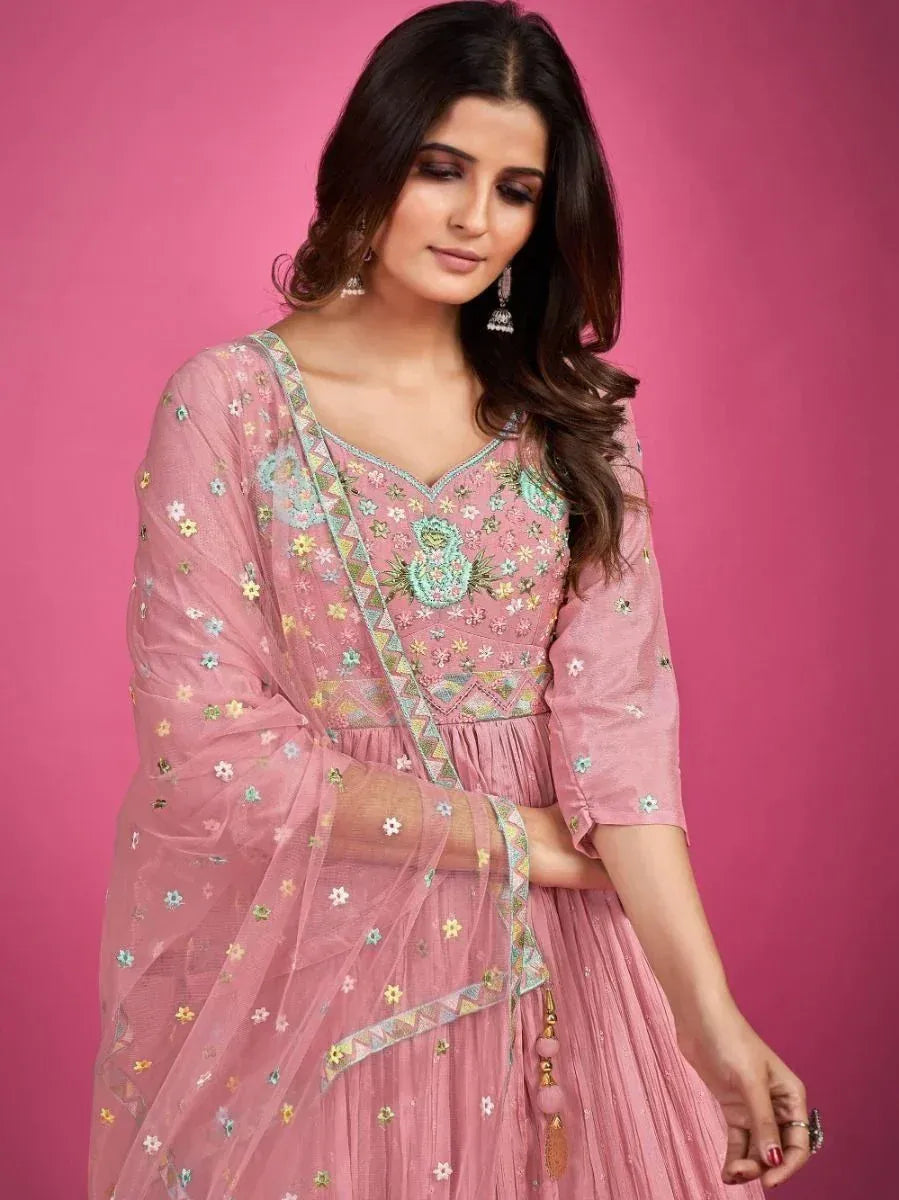 Pink embroidered ethnic gown with floral detailing and sheer dupatta, perfect for Indian occasions