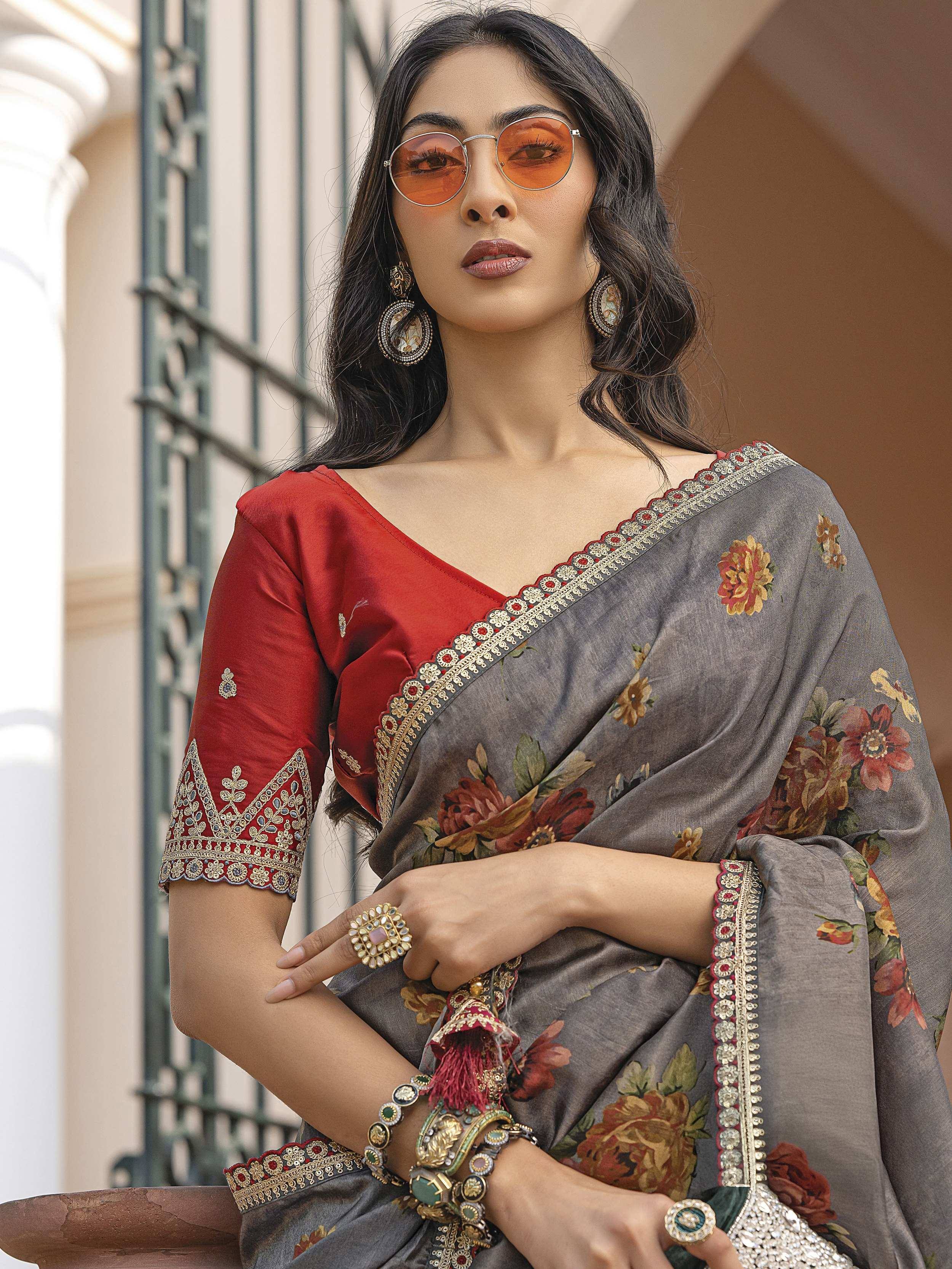 Grey floral saree with red blouse, gold embroidery, and statement jewelry for Indian ethnic wear