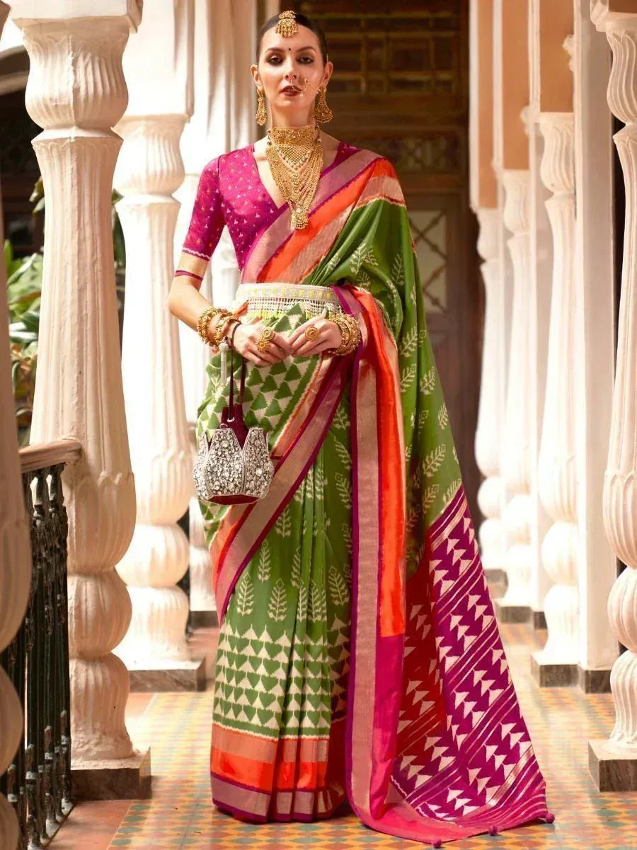 Green and pink printed saree with gold jewelry, traditional Indian ethnic wear for women