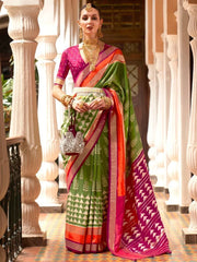 Gorgeous Green & Rani Printed Patola Silk Reception Wear Saree With Blouse