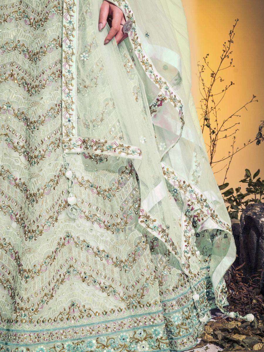 Mint green embroidered lehenga choli with floral zari work and sheer dupatta, perfect for Indian weddings