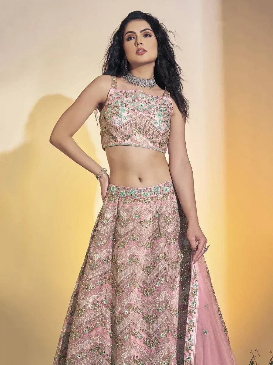 Pink embroidered lehenga choli with floral motifs, perfect for Indian ethnic wear and festive occasions.