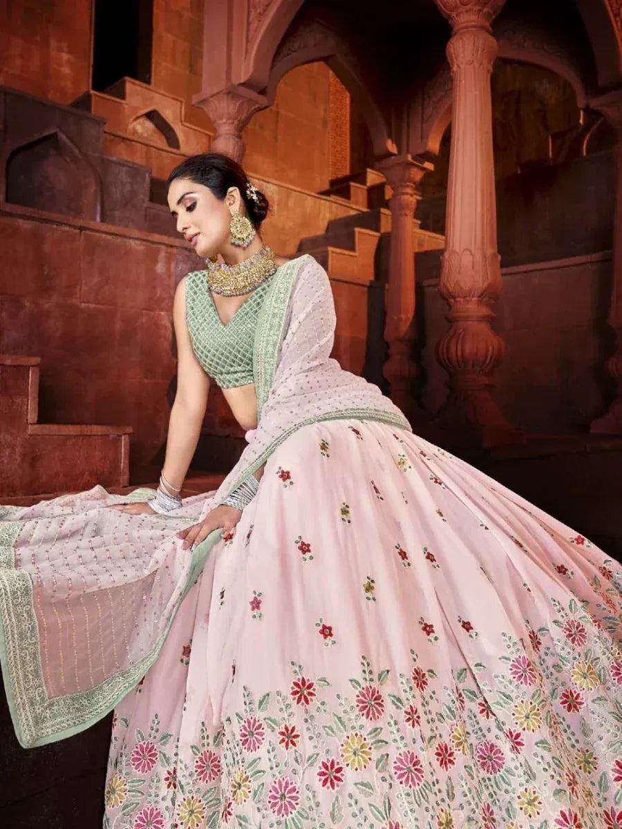 Pink floral lehenga choli with green blouse, perfect for Indian weddings and festive occasions