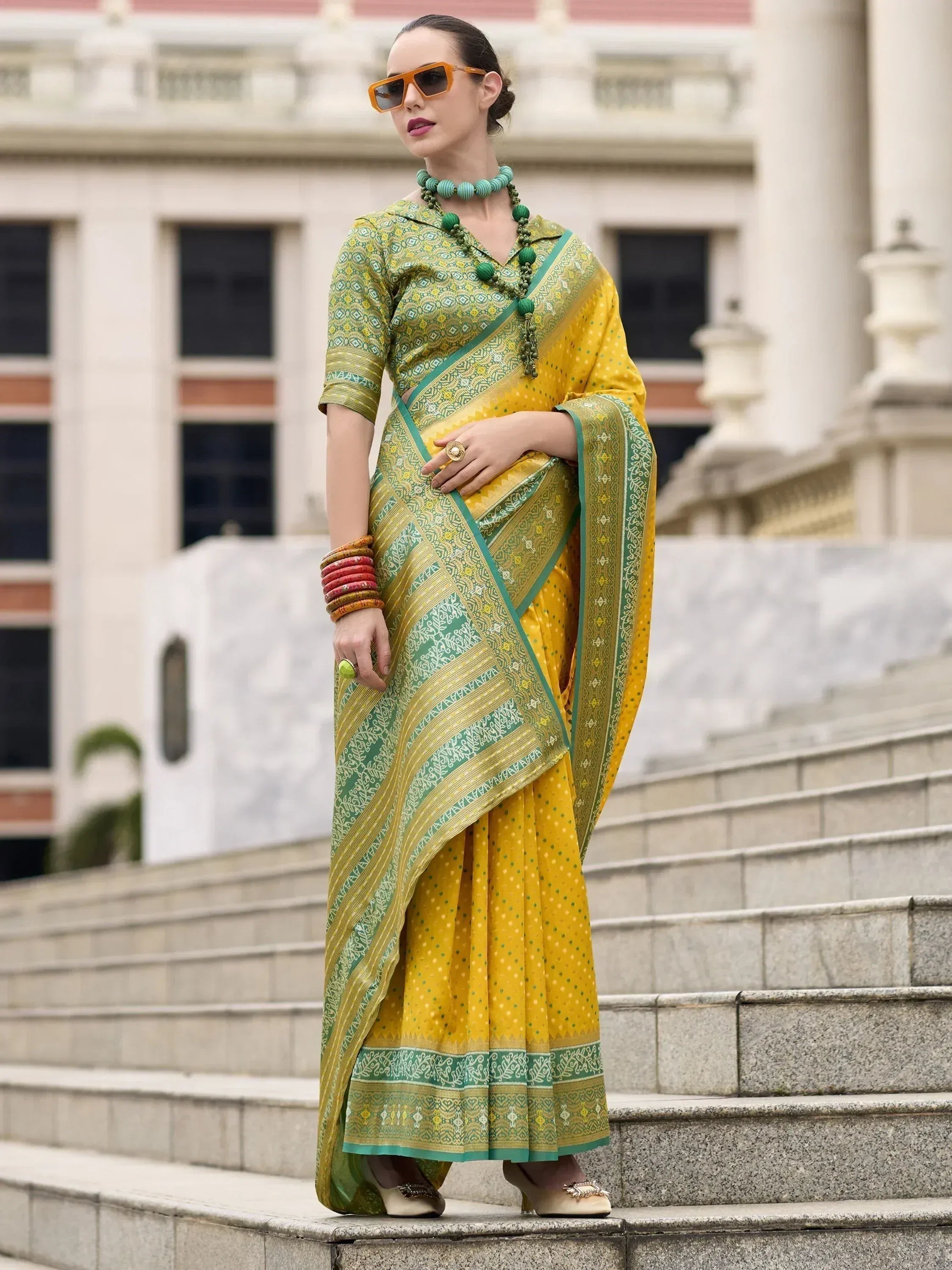 Yellow and green printed saree with ethnic blouse, perfect for Indian occasions and festive wear