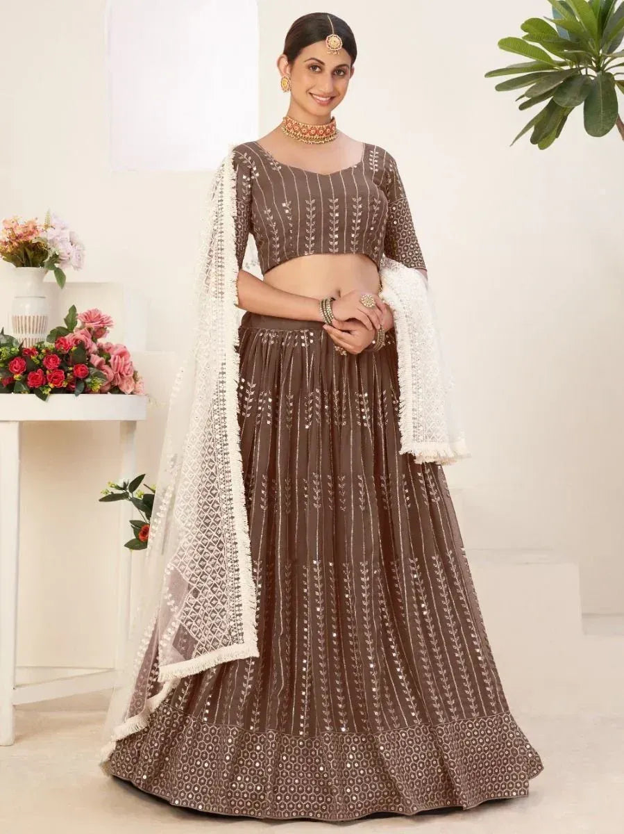 Brown embroidered lehenga choli with white dupatta, perfect for Indian ethnic wear occasions