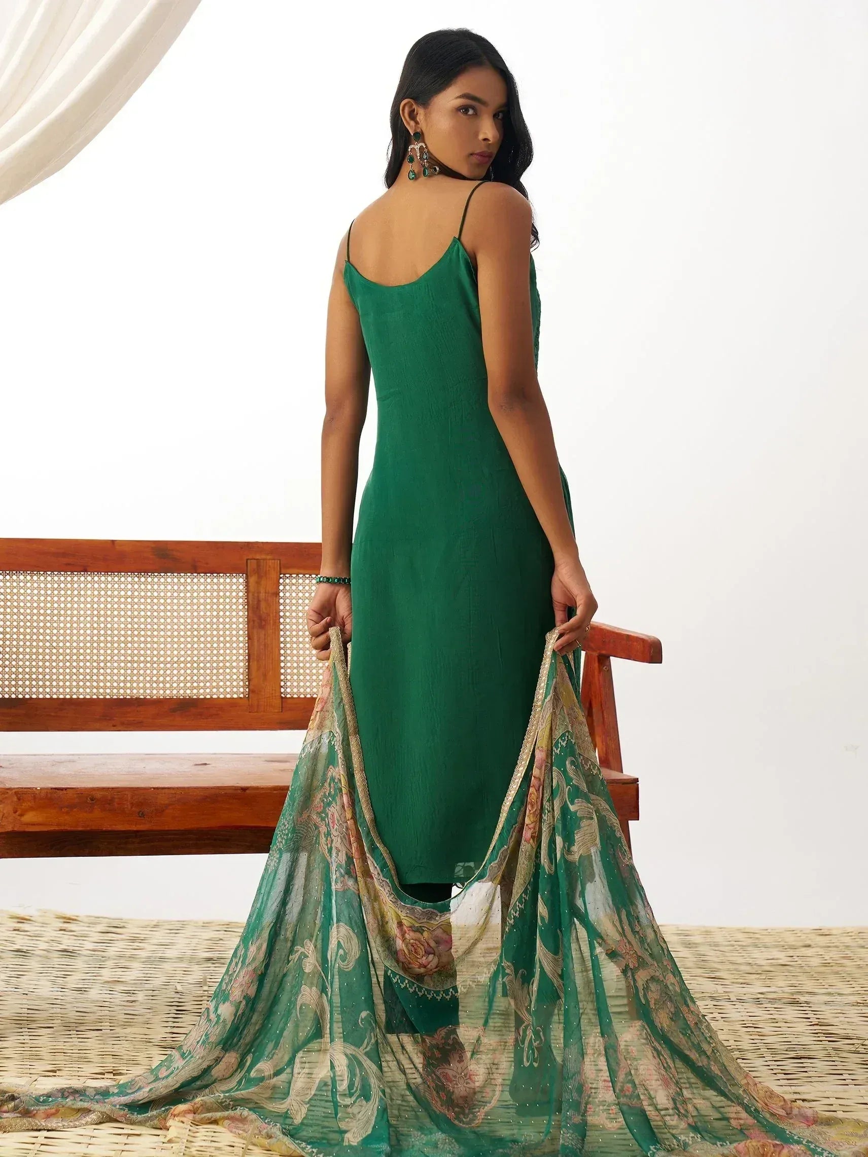 Emerald green ethnic gown with floral dupatta, perfect for Indian occasions and festive wear.