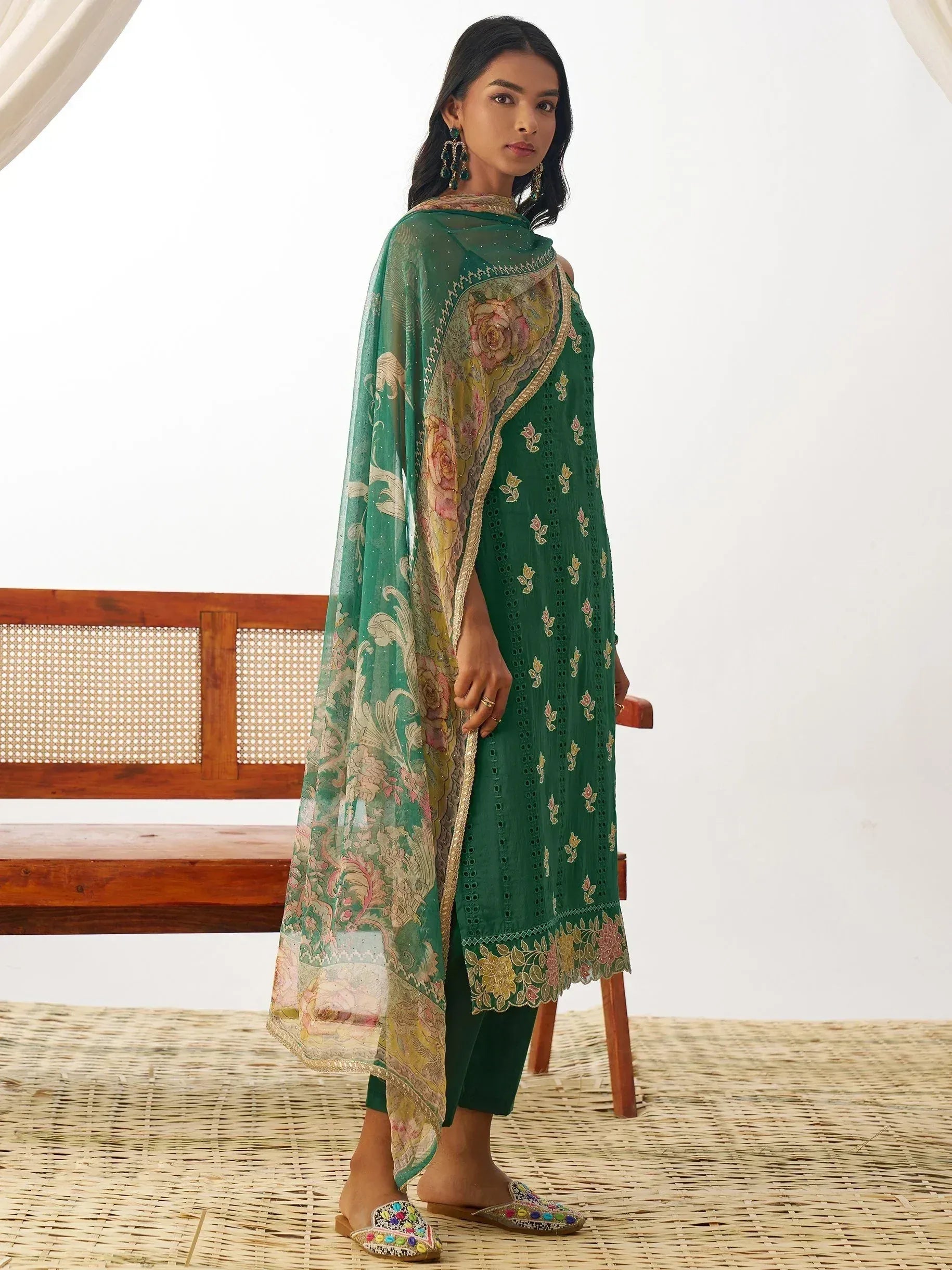Emerald green embroidered salwar kameez with floral dupatta, perfect for Indian ethnic wear occasions