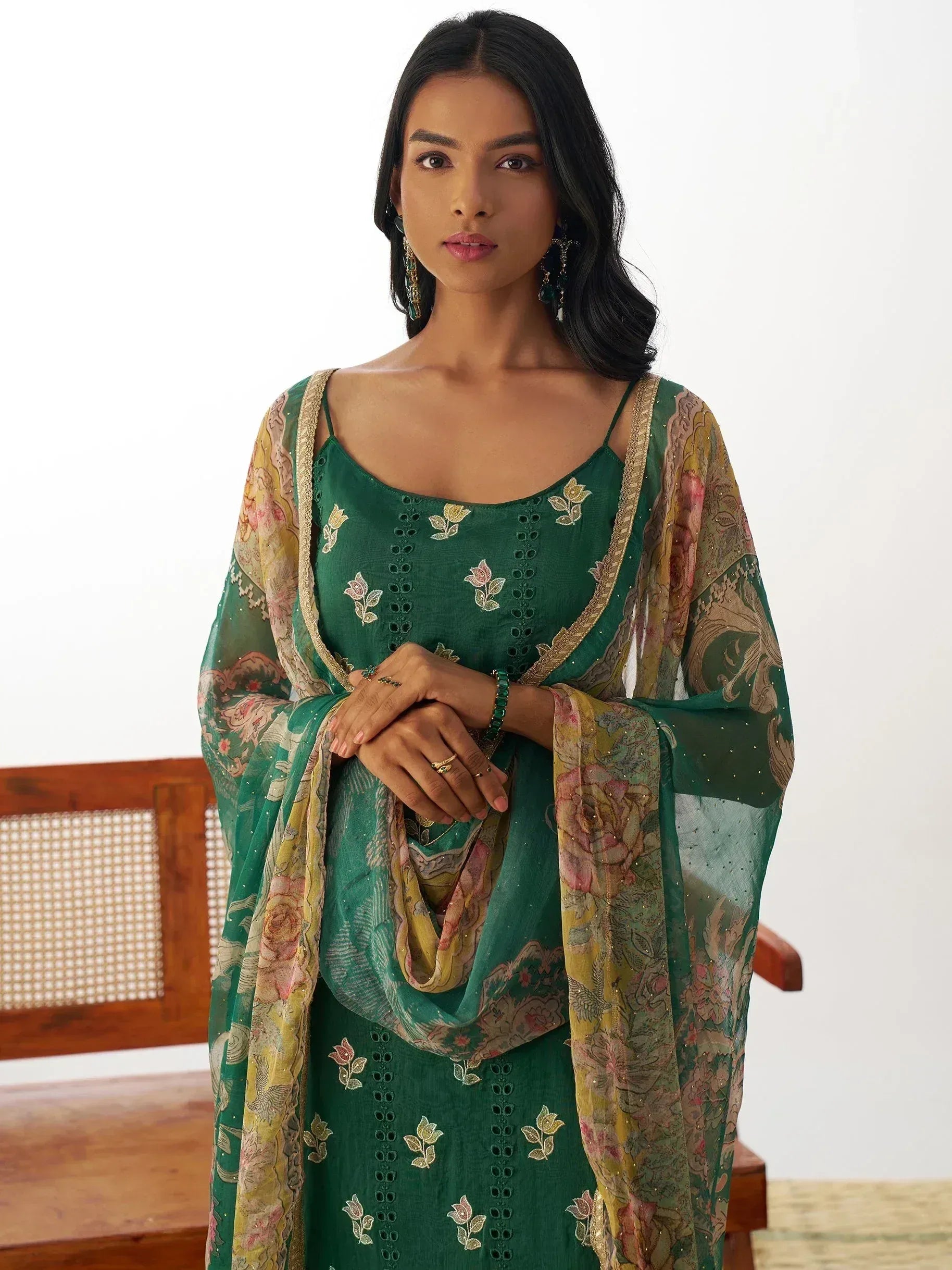 Emerald green embroidered ethnic gown with floral dupatta, perfect for Indian occasions and festive wear.