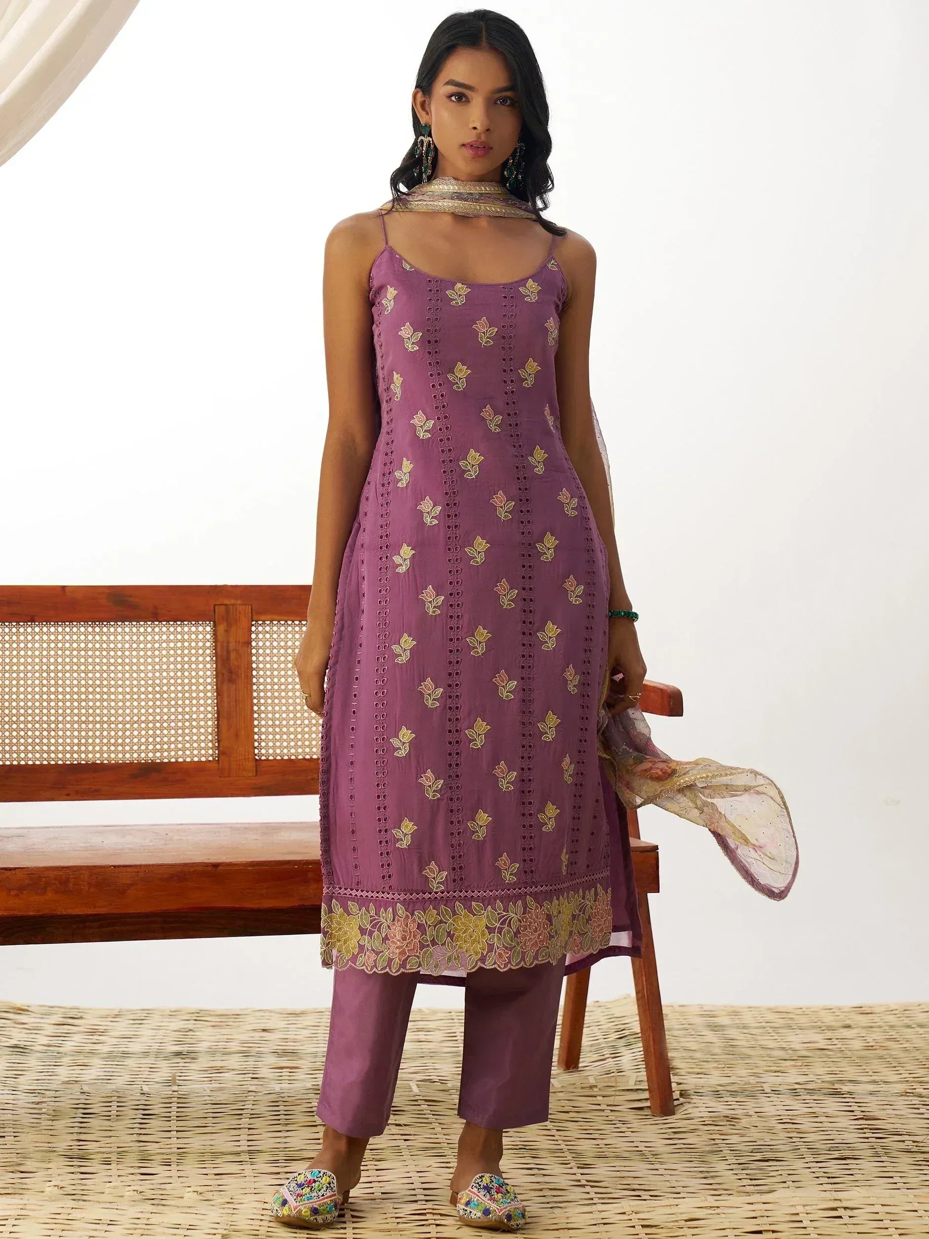 Purple embroidered ethnic kurti with floral motifs, matching pants, and dupatta for women