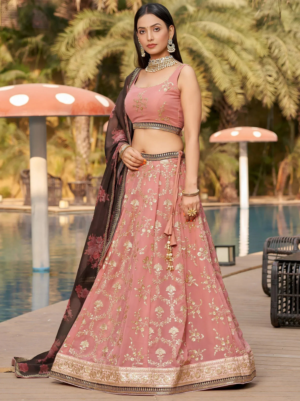 Pink embroidered lehenga choli with gold detailing, perfect for Indian ethnic wear occasions.