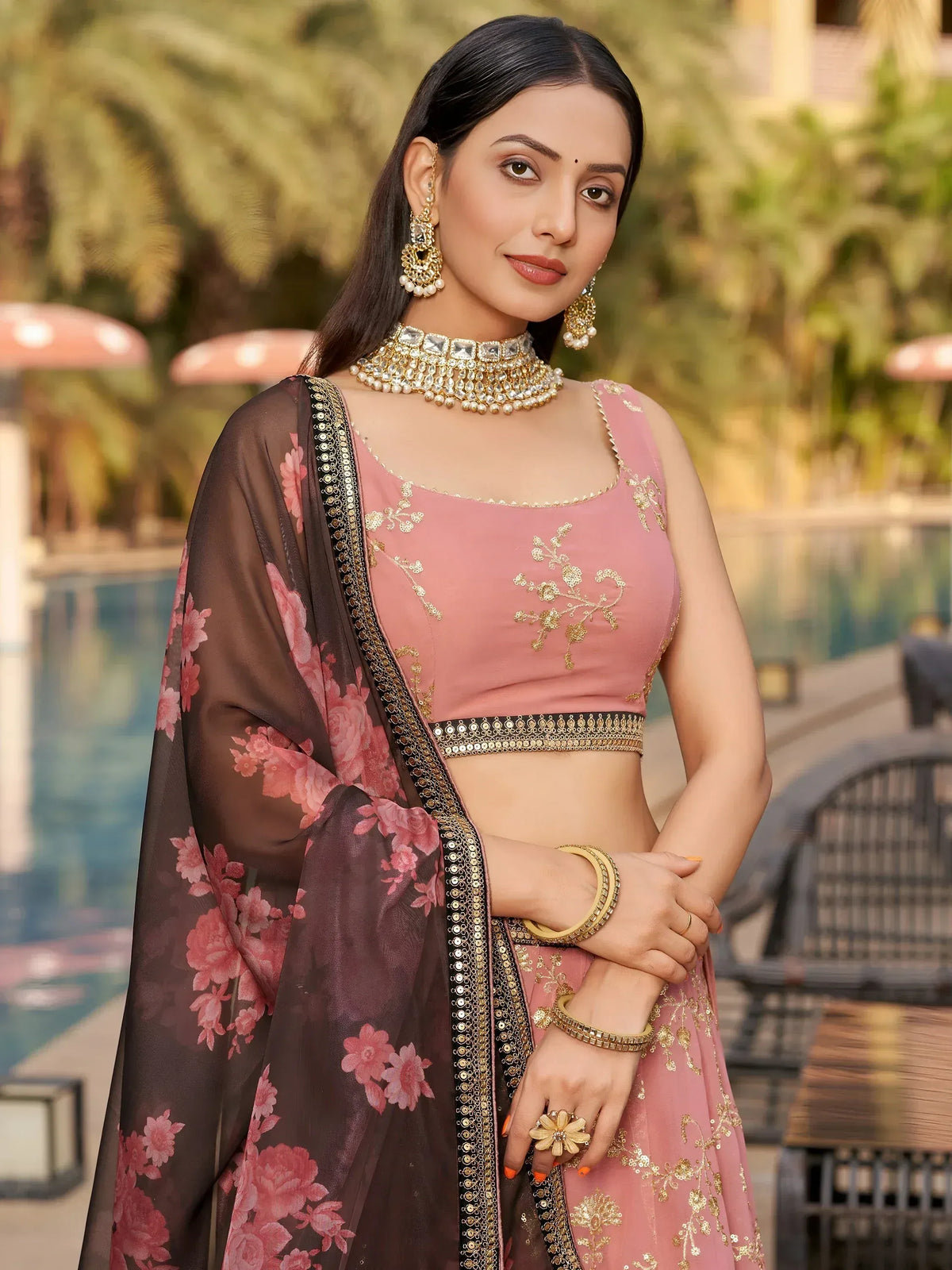 Pink embroidered lehenga choli with floral dupatta, perfect for Indian ethnic wear and festive occasions.