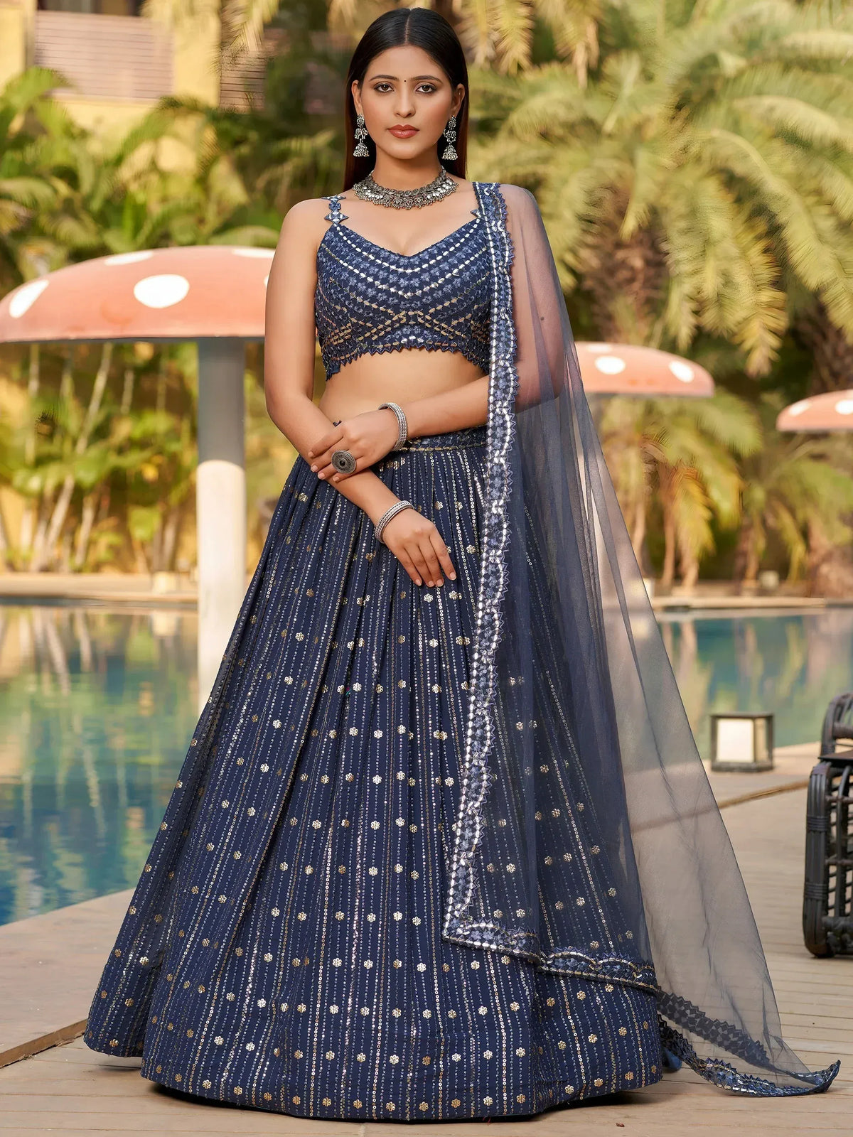 Elegant navy blue lehenga choli with gold embroidery, perfect for Indian ethnic wear events.