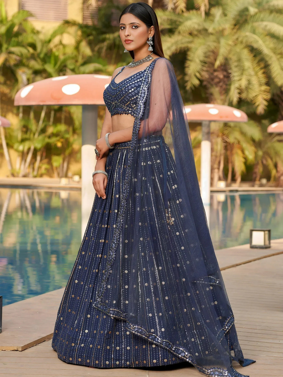 Navy blue designer lehenga choli with gold sequin work, perfect for weddings and parties