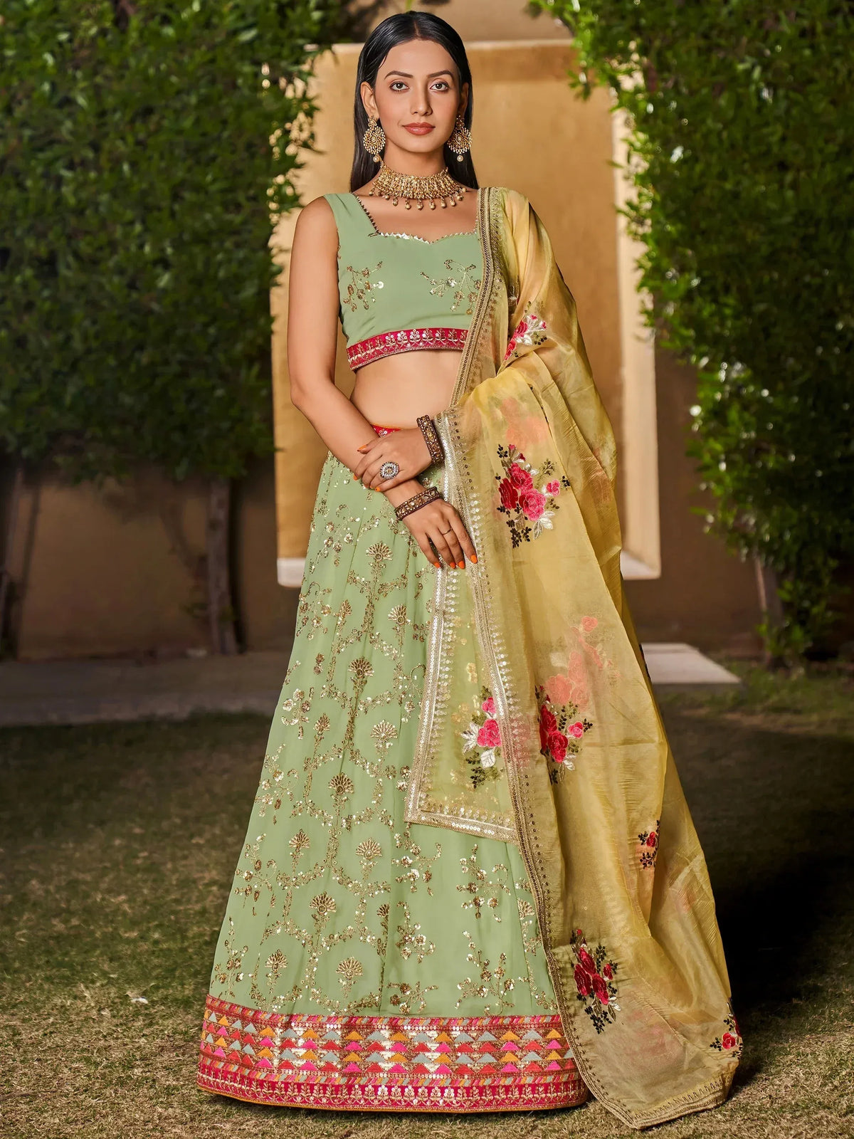 Mint green embroidered lehenga choli with floral dupatta, perfect for Indian weddings and festive occasions
