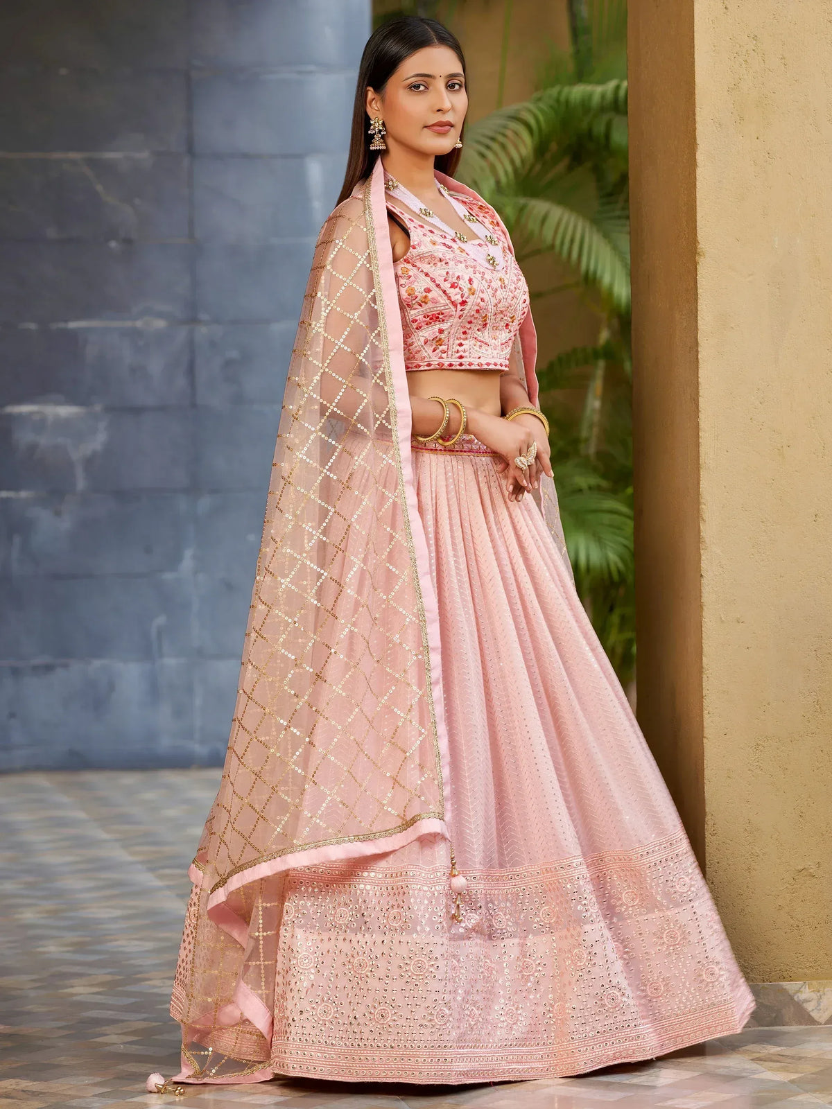 Pink embroidered lehenga choli with gold sequin dupatta, perfect for Indian ethnic occasions