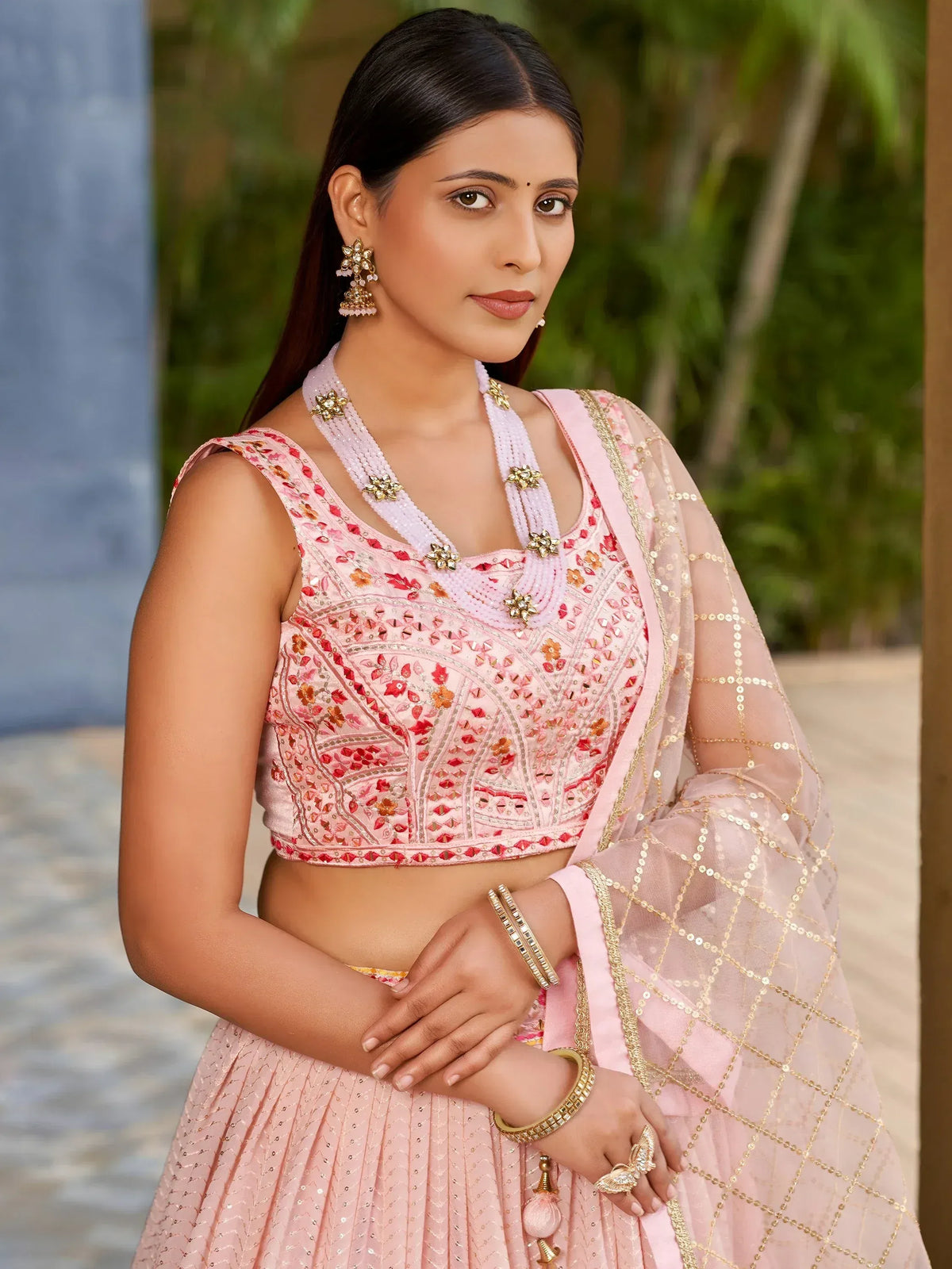 Pink embroidered lehenga choli with gold sequin dupatta, perfect for Indian ethnic wear occasions