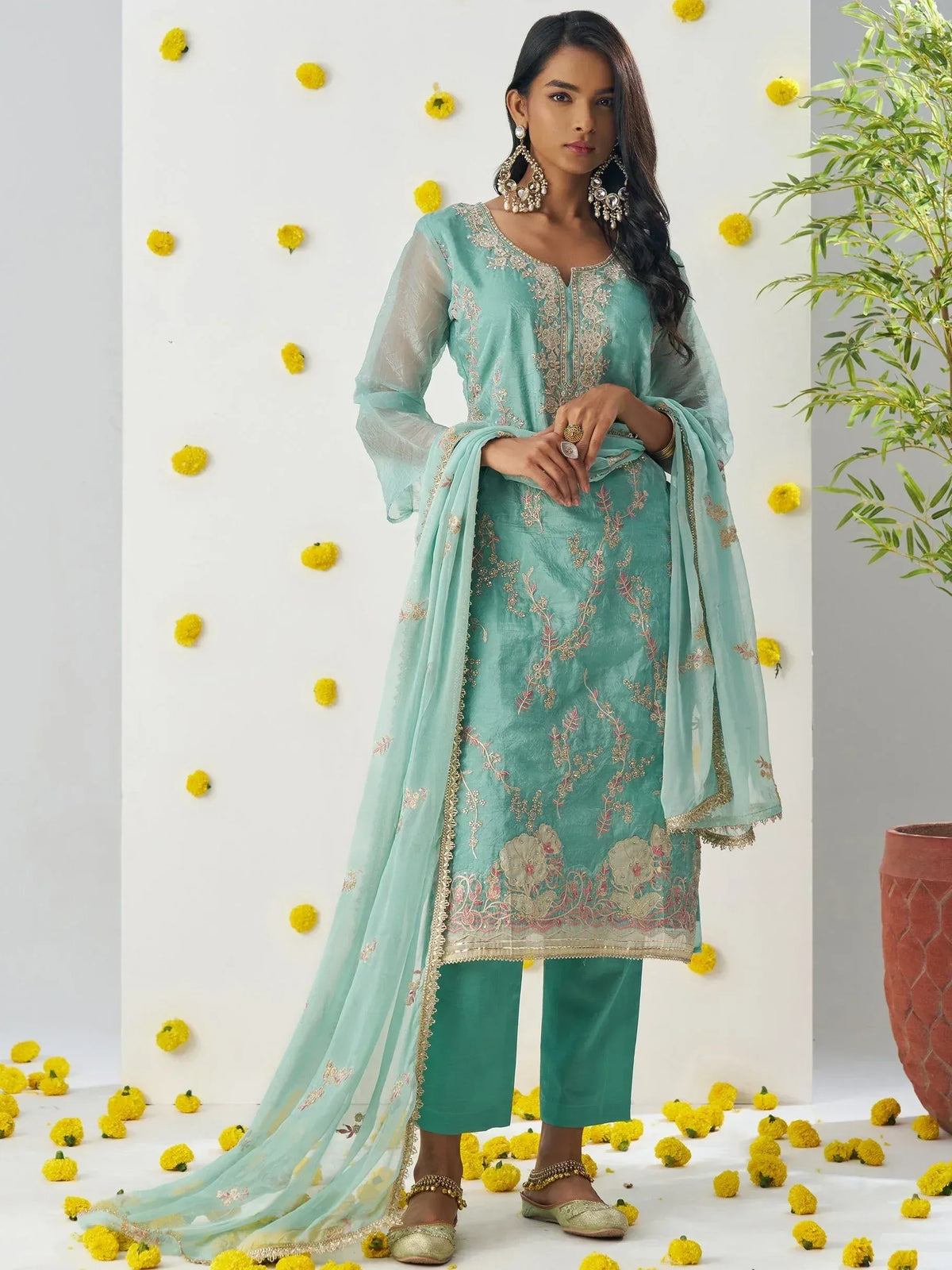 Mint green embroidered salwar kameez with sheer dupatta, floral detailing, and matching pants for ethnic wear