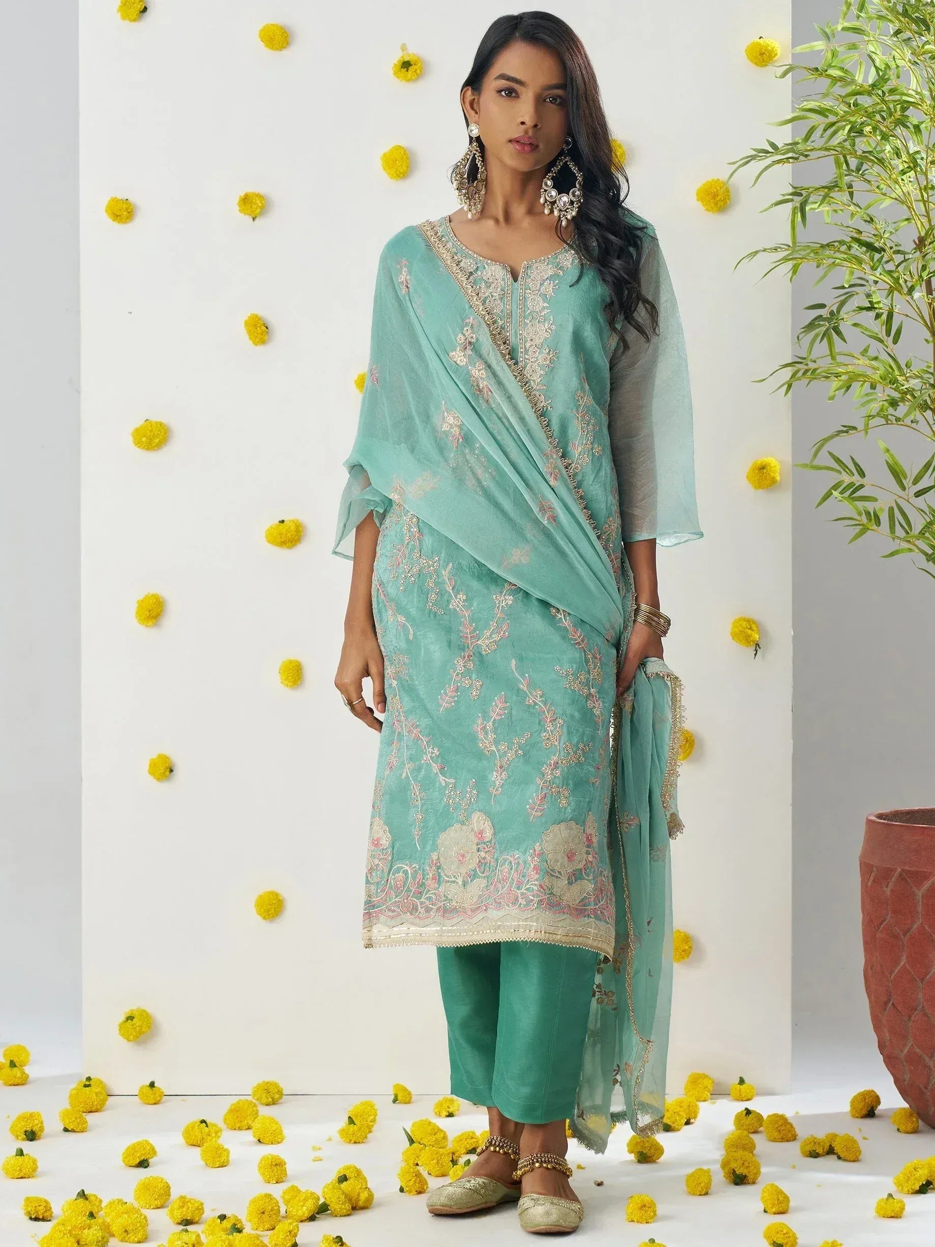 Mint green embroidered salwar kameez with floral detailing, perfect for Indian ethnic wear occasions
