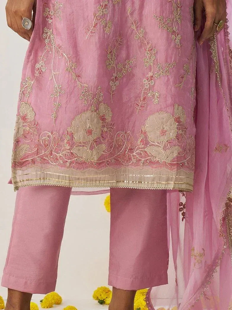 Pink embroidered salwar kameez with floral gold detailing, matching dupatta, and cropped pants