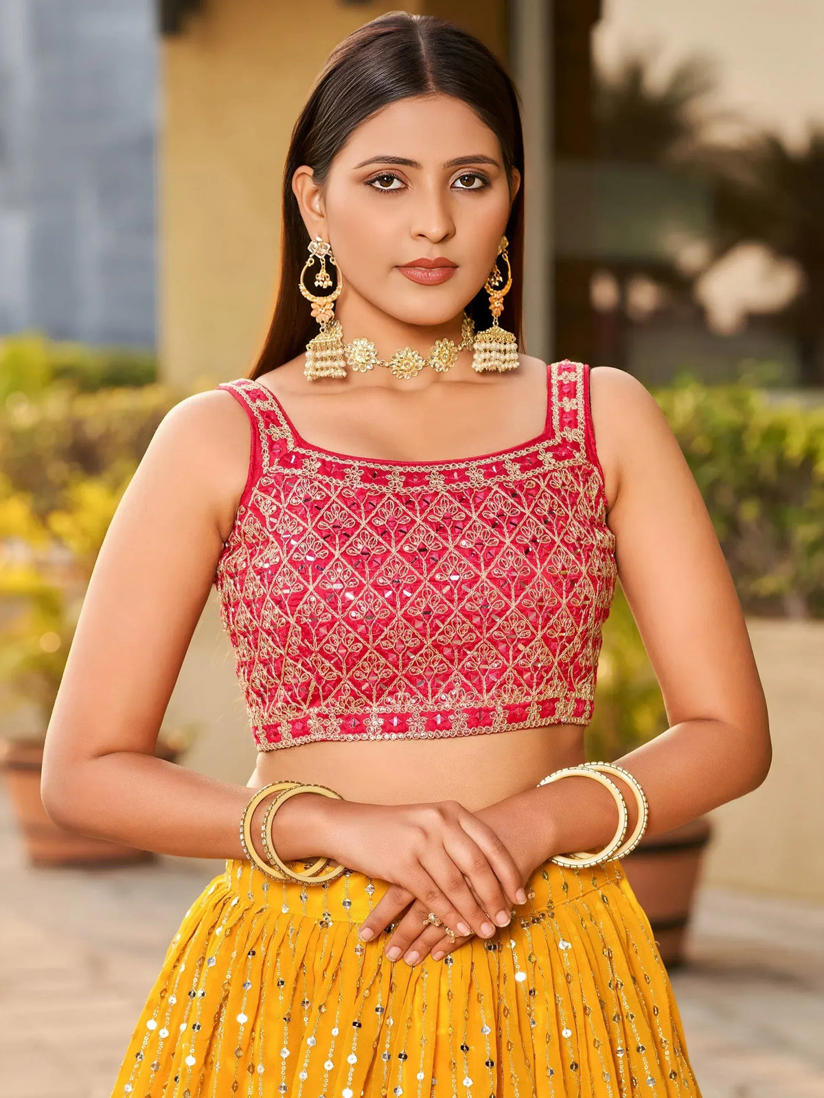 Red and gold embroidered blouse with yellow lehenga, perfect for Indian ethnic wear