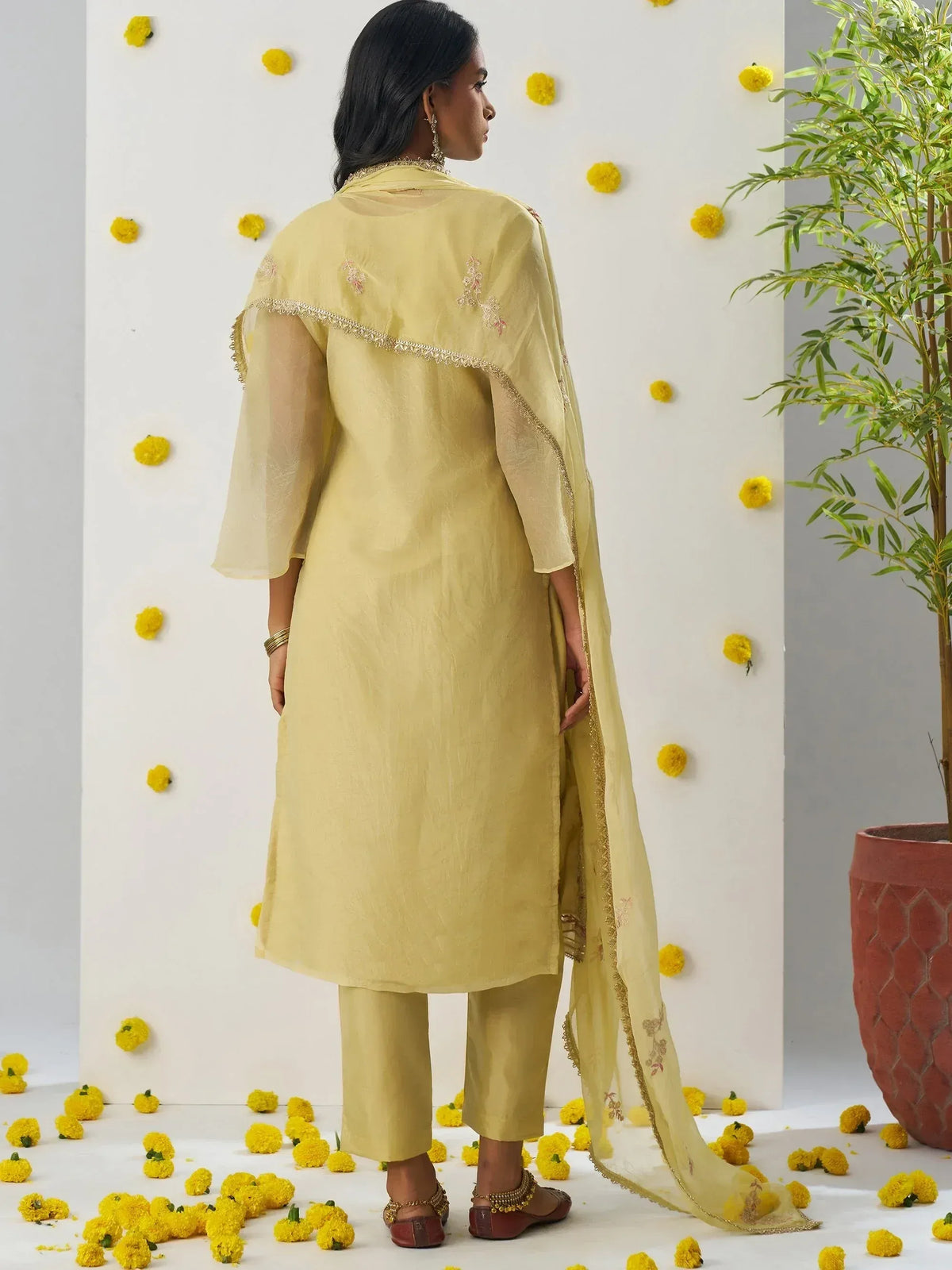 Yellow ethnic salwar kameez with embroidered dupatta, perfect for festive occasions and traditional events.
