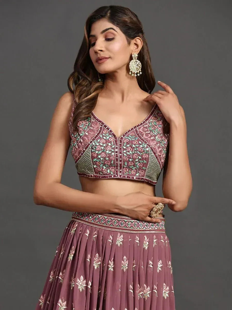 Elegant maroon lehenga choli with floral embroidery and mirror work, perfect for Indian ethnic occasions