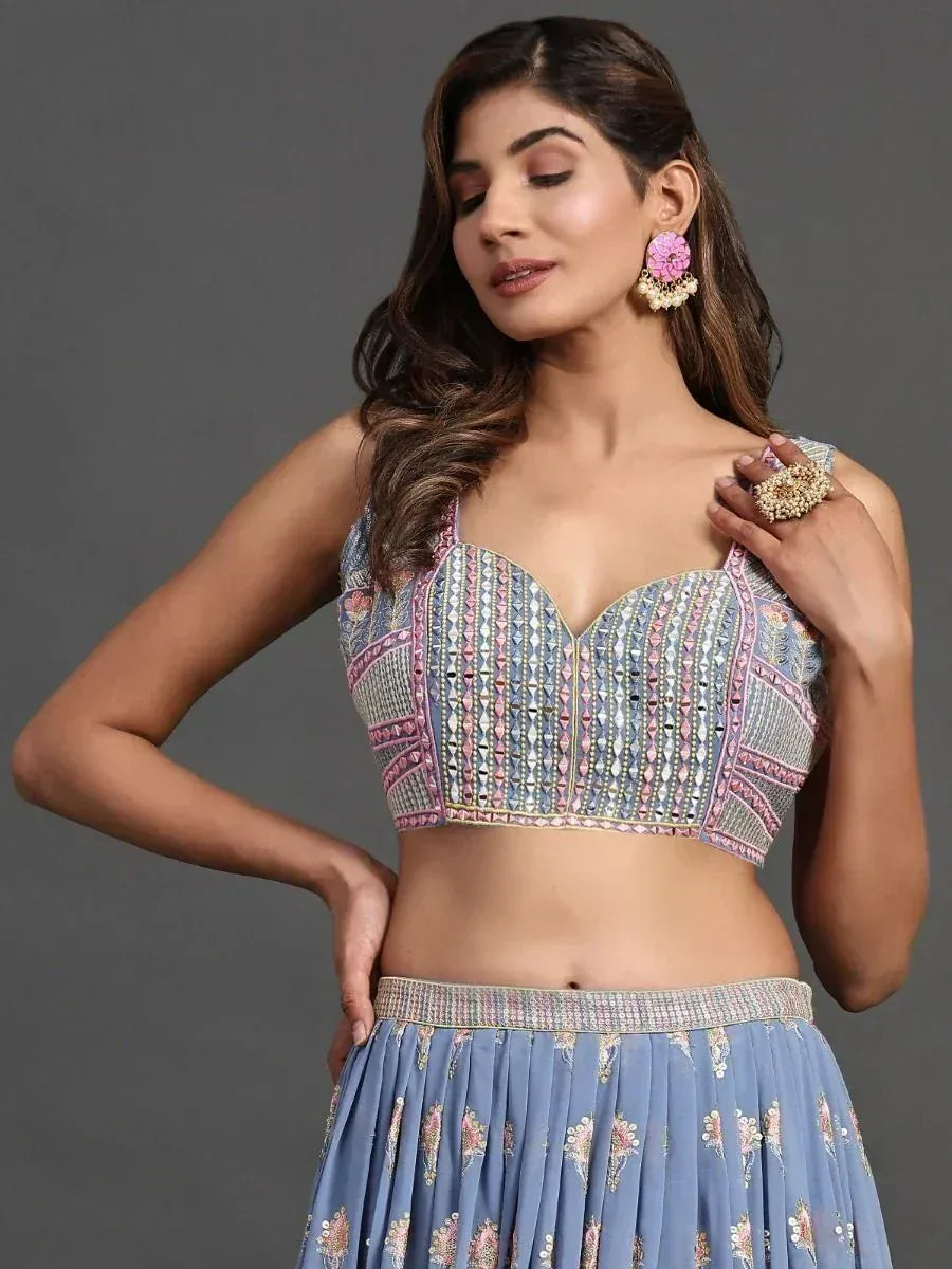 Blue embroidered lehenga choli with floral motifs, perfect for Indian ethnic wear and festive occasions.