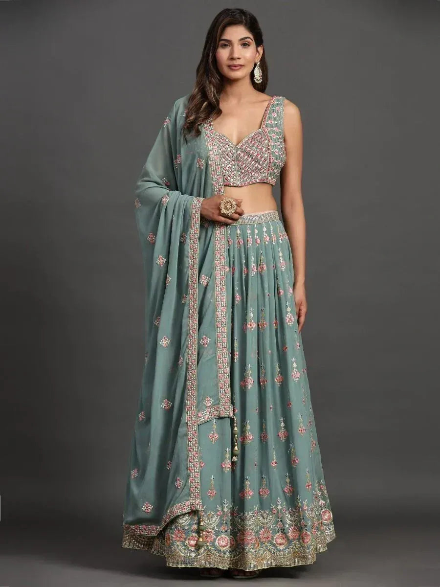 Mint green embroidered lehenga choli with floral motifs and dupatta, perfect for Indian ethnic occasions