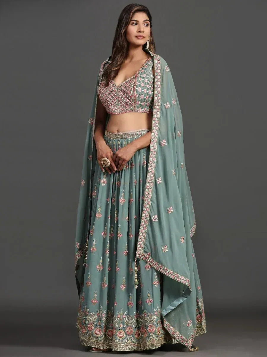 Mint green embroidered lehenga choli with floral motifs and dupatta, perfect for Indian ethnic occasions