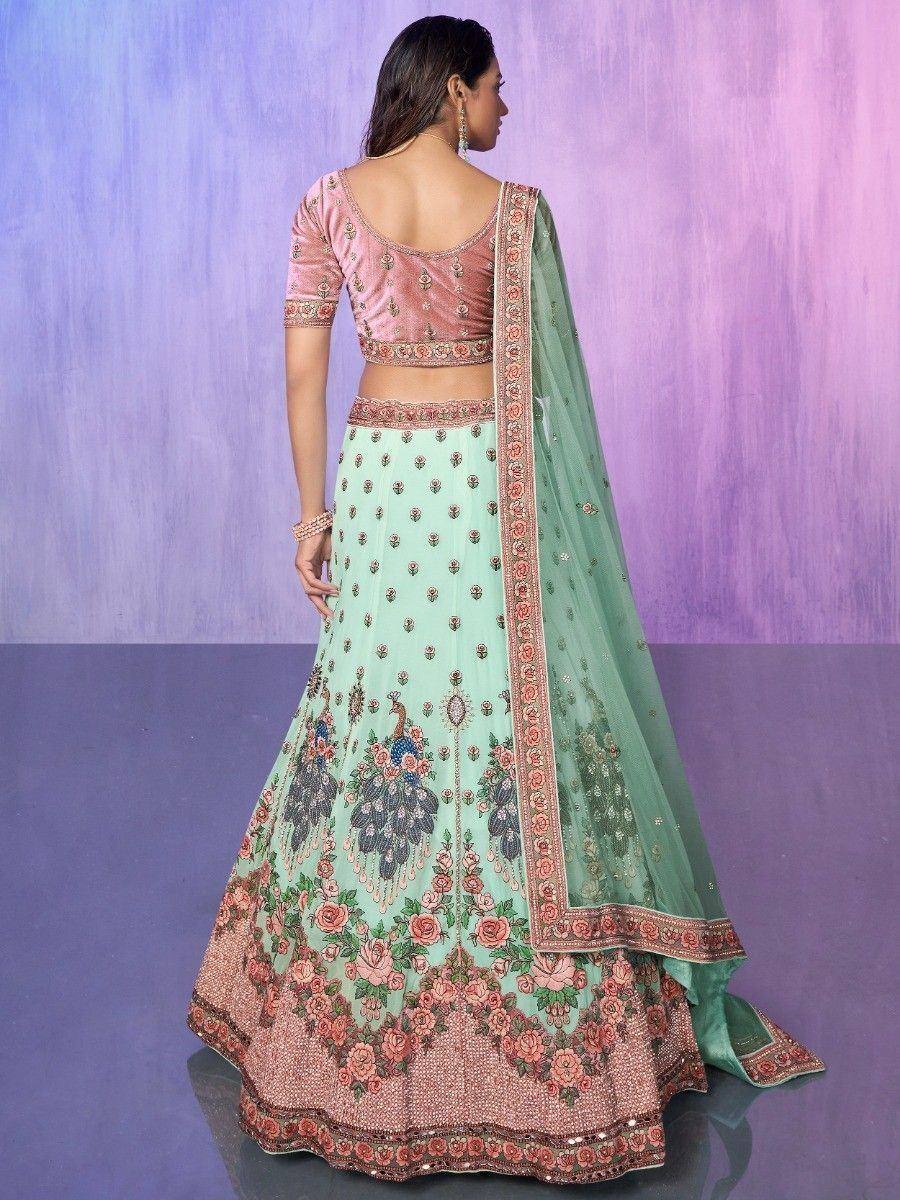 Mint green lehenga choli with floral embroidery and peacock motif, perfect for Indian ethnic occasions