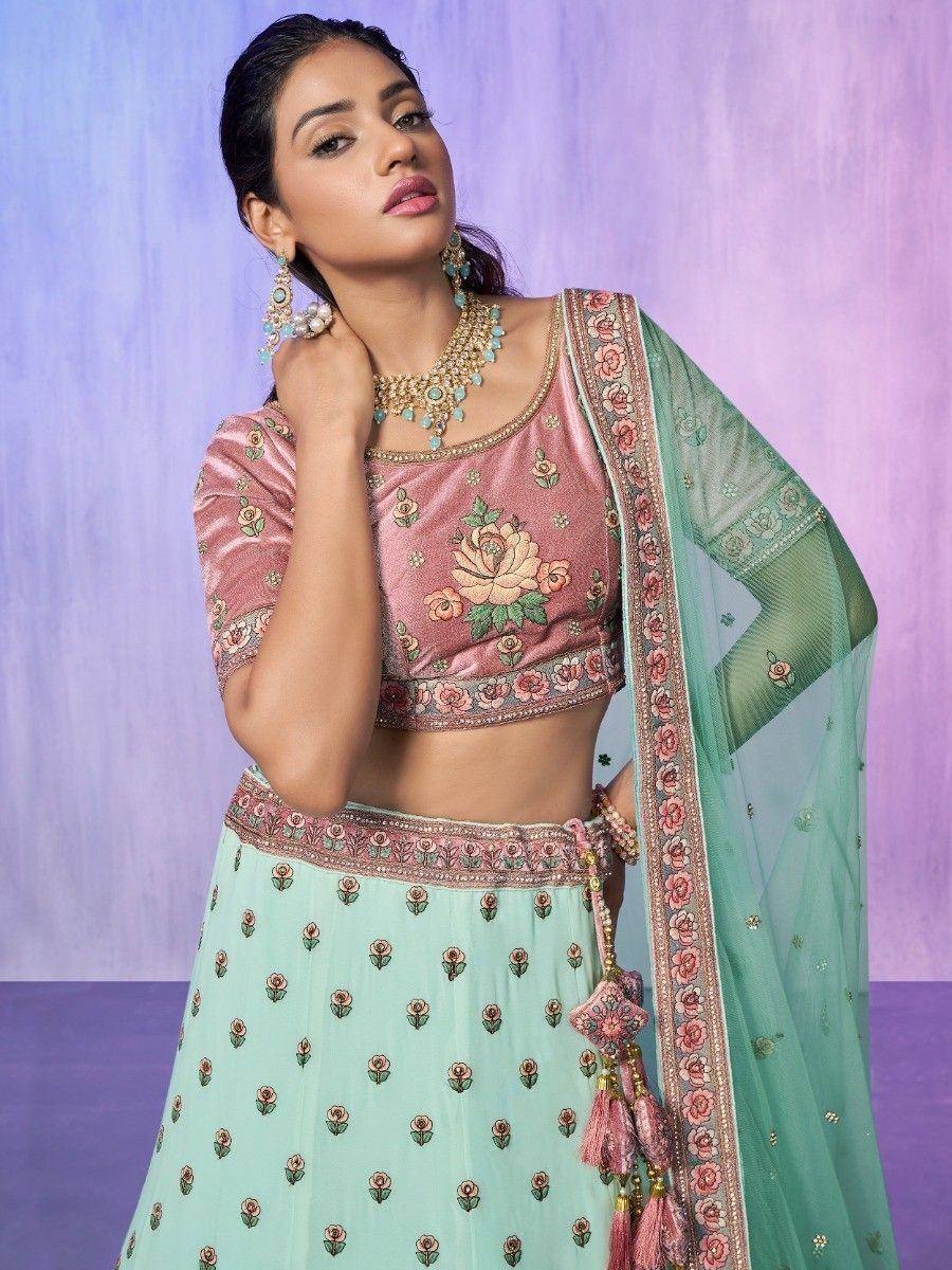 Pink floral embroidered lehenga choli with mint green skirt and dupatta, perfect for Indian ethnic occasions