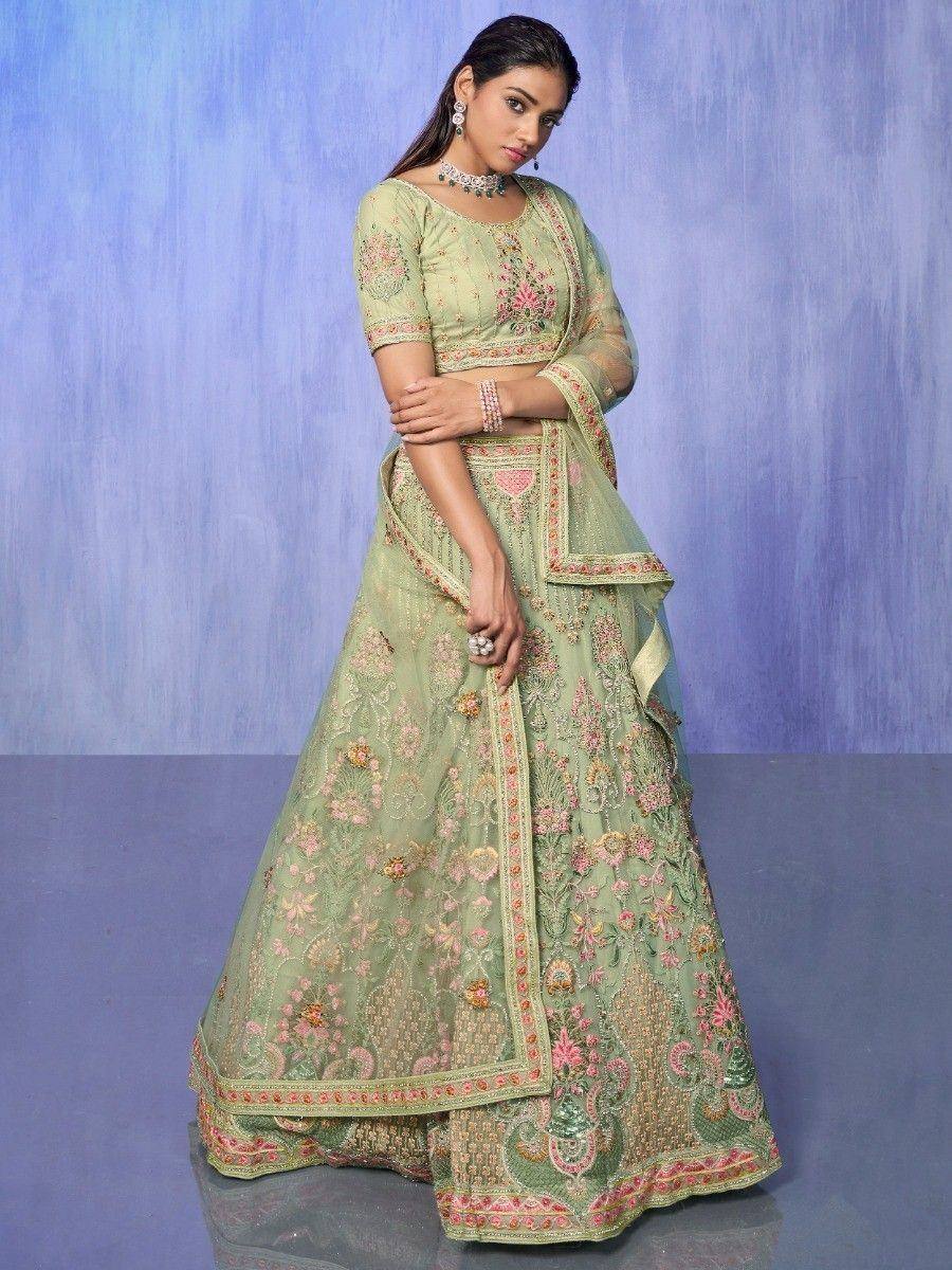 Mint green embroidered lehenga choli with floral motifs, perfect for Indian ethnic wear occasions.