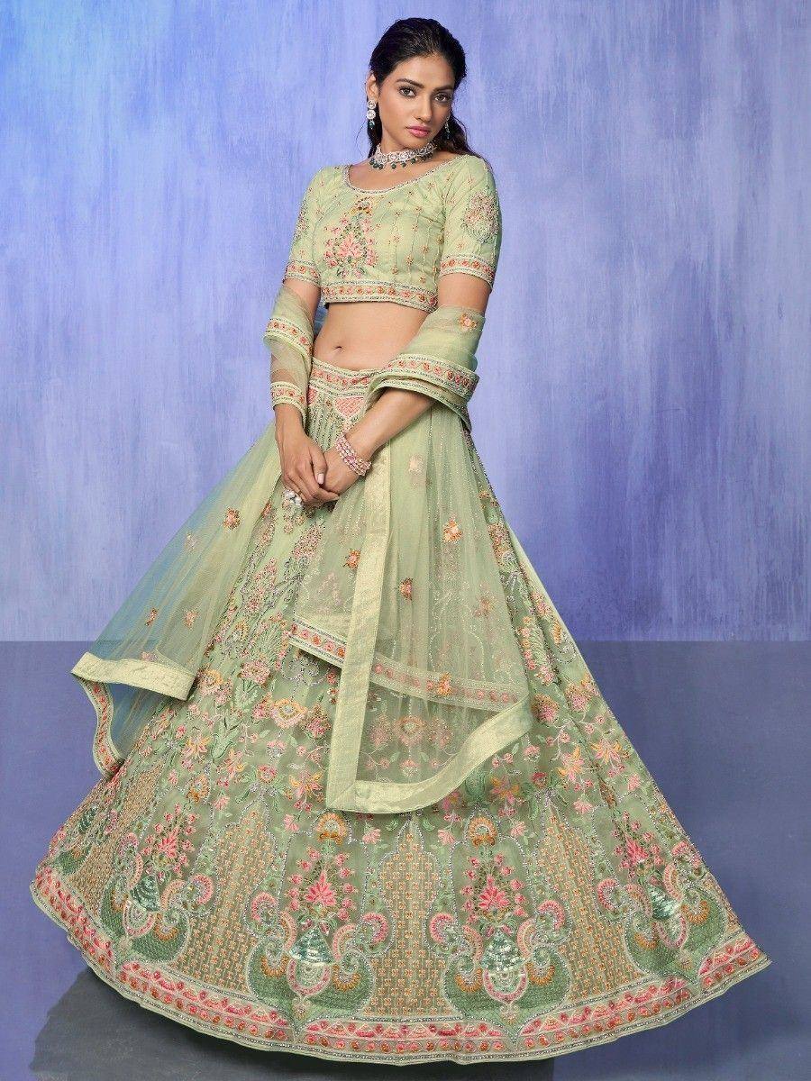 Mint green embroidered lehenga choli with floral motifs, perfect for Indian ethnic wear occasions.
