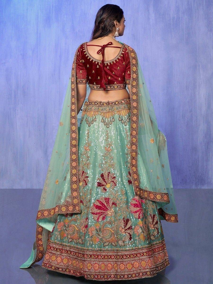 Mint green lehenga choli with maroon velvet blouse, floral embroidery, and sheer dupatta for Indian ethnic wear