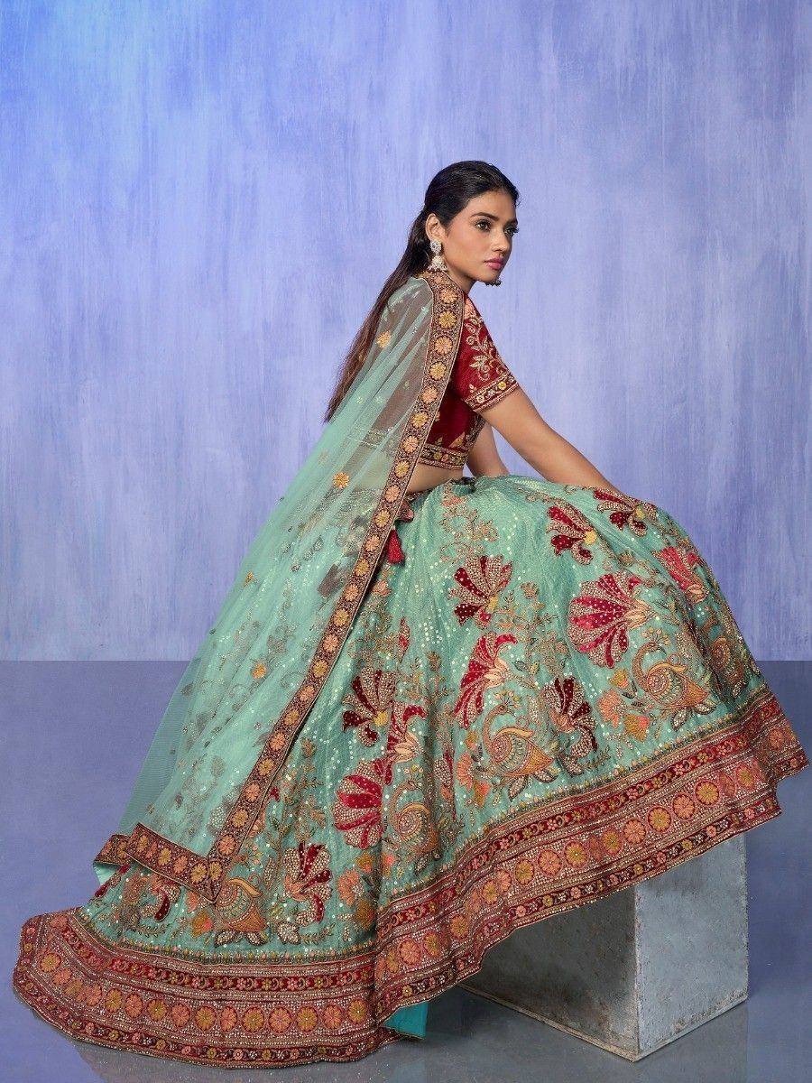 Mint green designer lehenga choli with red floral embroidery and matching dupatta, perfect for Indian weddings.