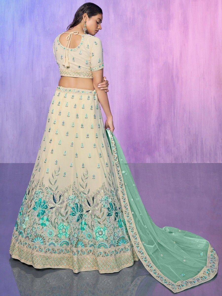 Cream and mint green embroidered lehenga choli with floral detailing and matching dupatta, perfect for Indian ethnic wear.