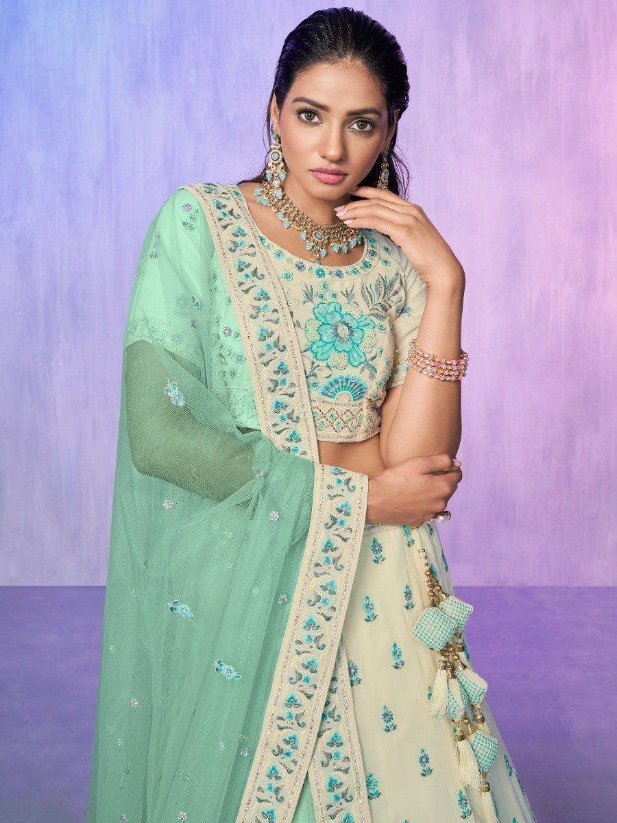 Mint green embroidered lehenga choli with floral motifs and matching dupatta, perfect for Indian ethnic occasions.