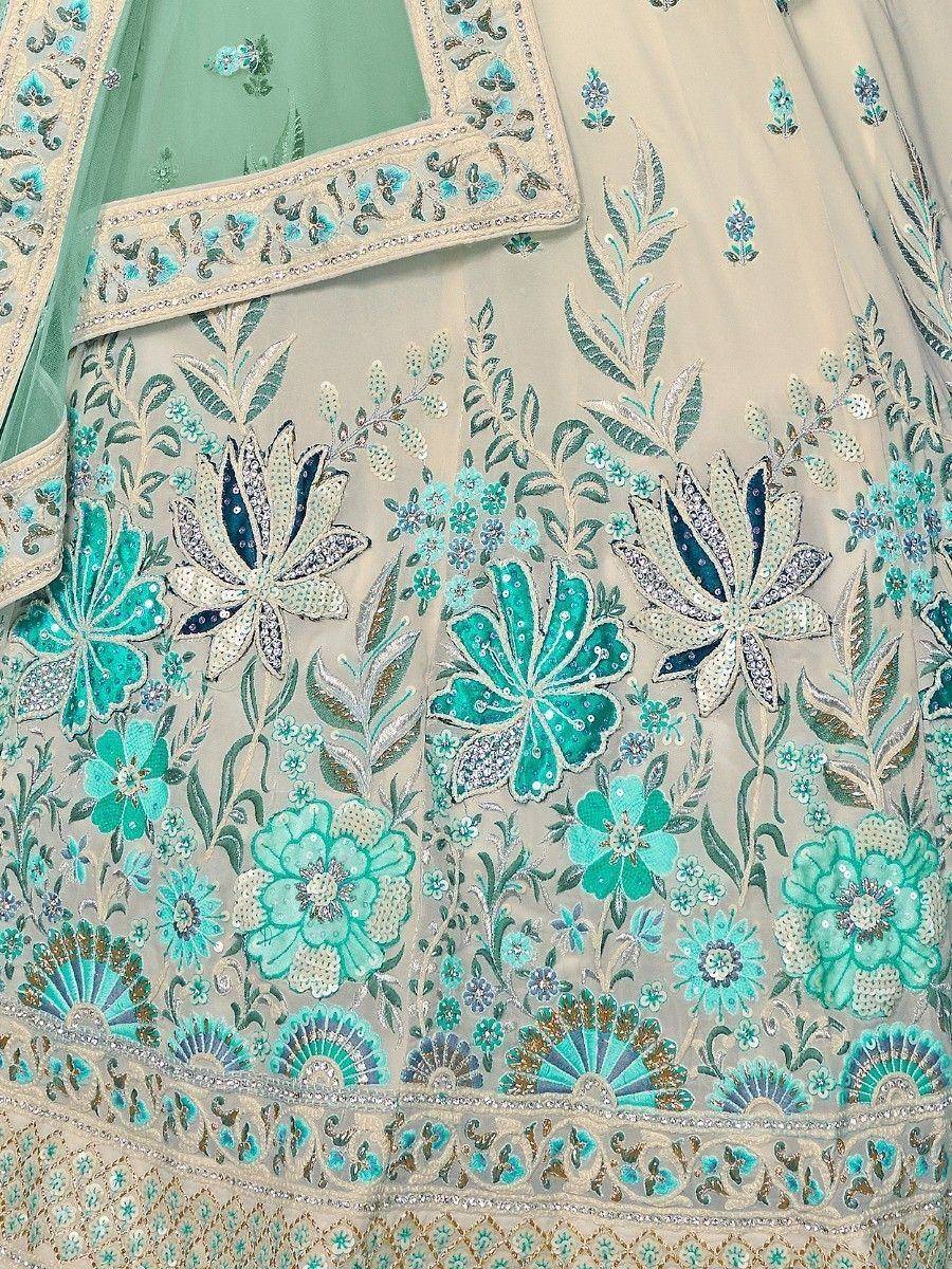 Elegant floral embroidered lehenga choli with turquoise and silver detailing, perfect for Indian ethnic wear.